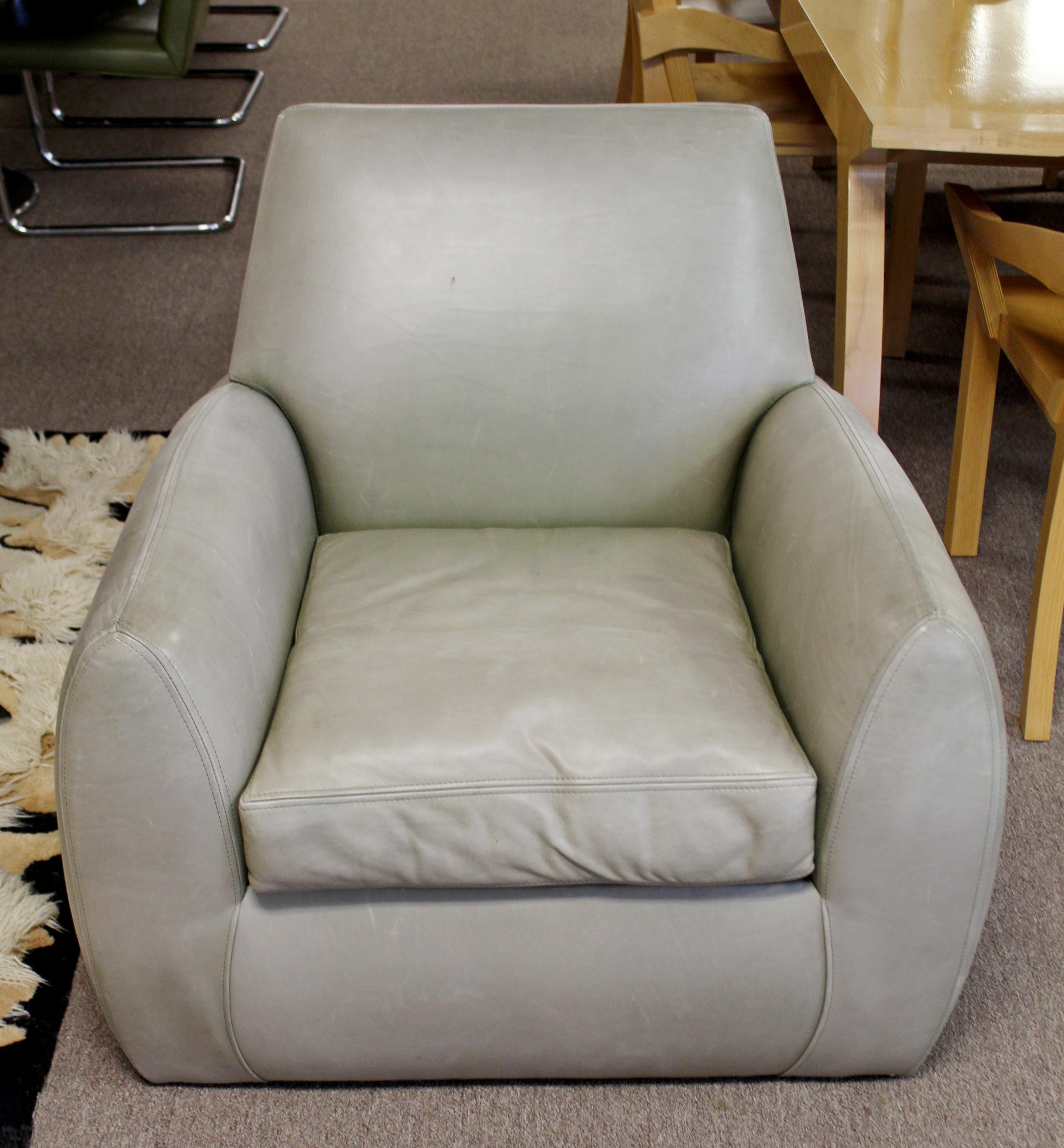 For your consideration is a gorgeous, club lounge armchair upholstered in gray leather, by Dakota Jackson, circa 1980s. In very good vintage condition. The dimensions are 32
