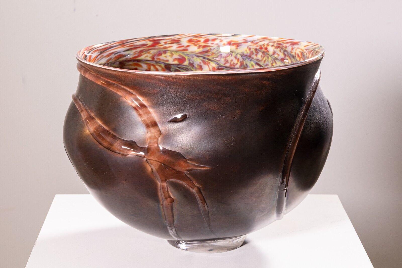 A David Helm hand blown glass bowl. This wonderful glass bowl has been hand blown by glass artist David Helm. The details in this piece are absolutely stunning. The outside of the bowl features an opaque brown finish with splotches of clear glass