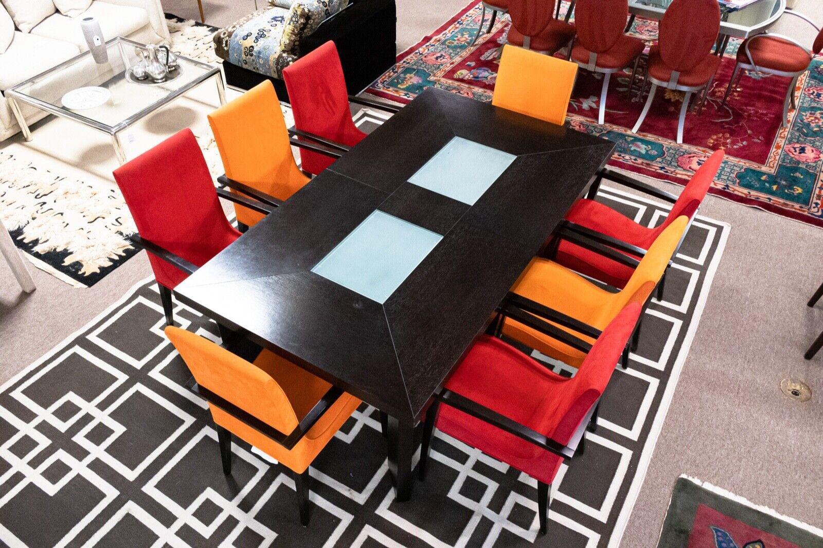 Le Shoppe Too presents this very modern expandable dark brown ebonized wood table with glass inserts. Very similar to Roche Bobois. Custom Made. Comes with a set of 8 colorful arm chairs in a plush microfiber upholstery. In excellent condition.