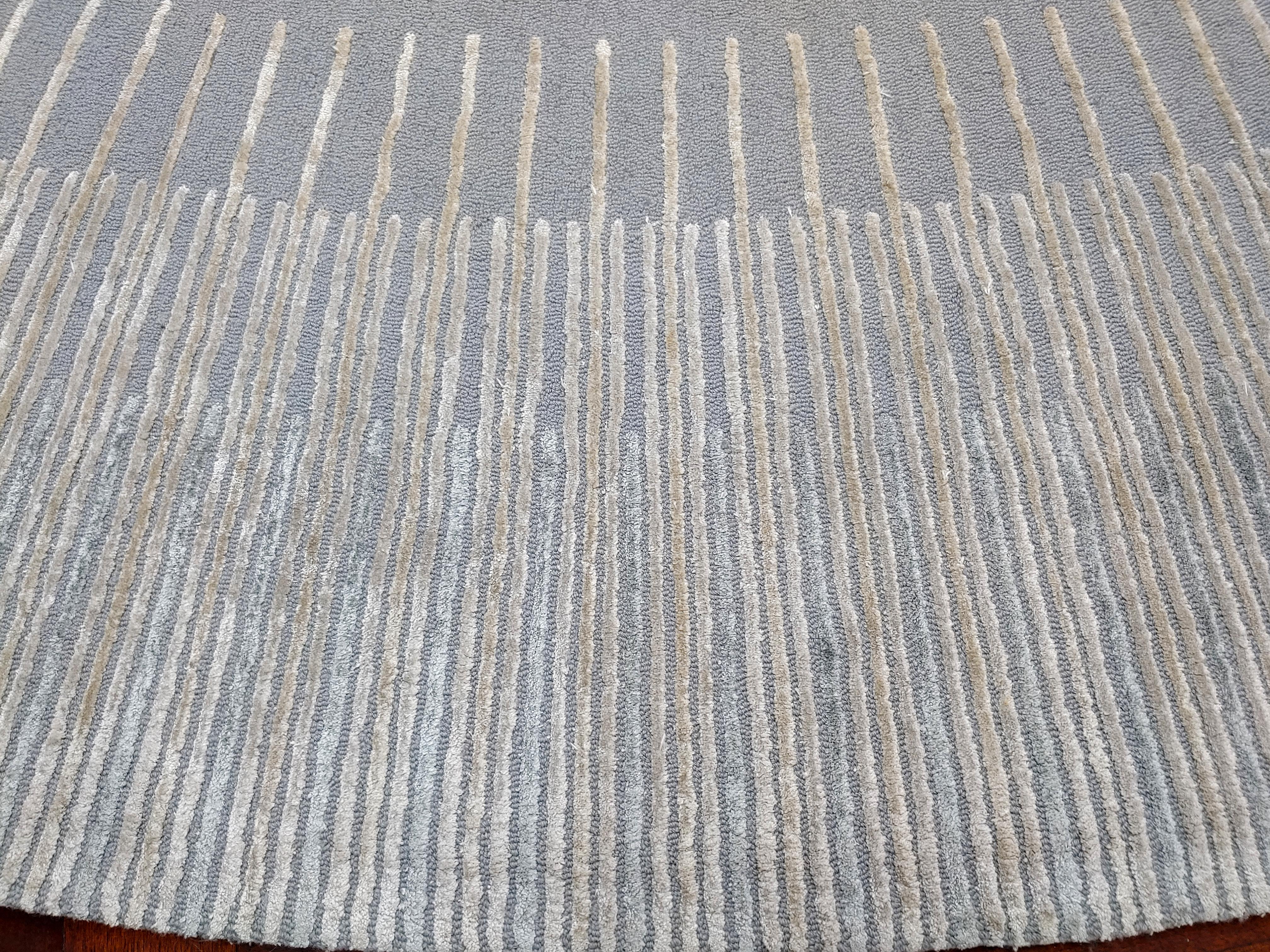 For your consideration is a magnificent and massive, round area rug or carpet, in a light blue gray, by Edward Fields, circa 1980s. In very good vintage condition. The dimensions are 192