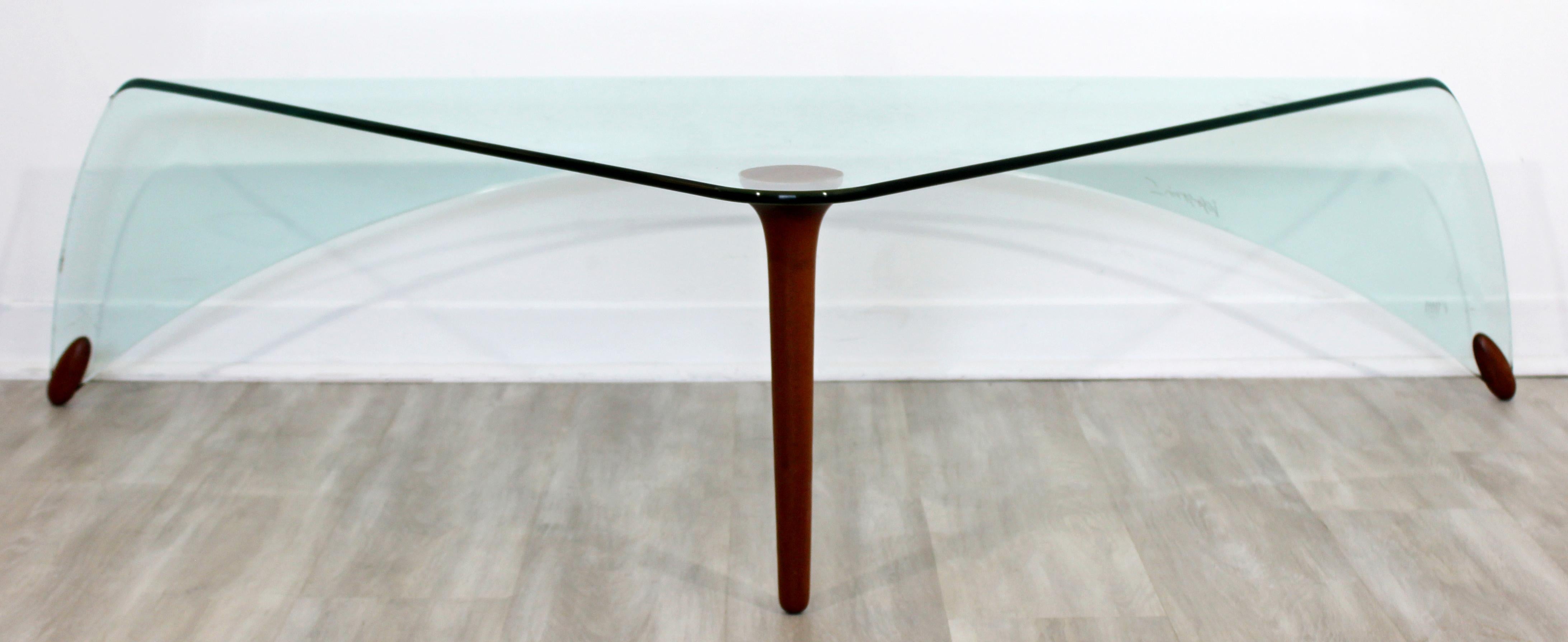 For your consideration is a show-stopping piece of art in the shape of a slumped and draped glass coffee table, signed and made by Fiam Italia, circa 1990s. In very good vintage condition. The dimensions are 62
