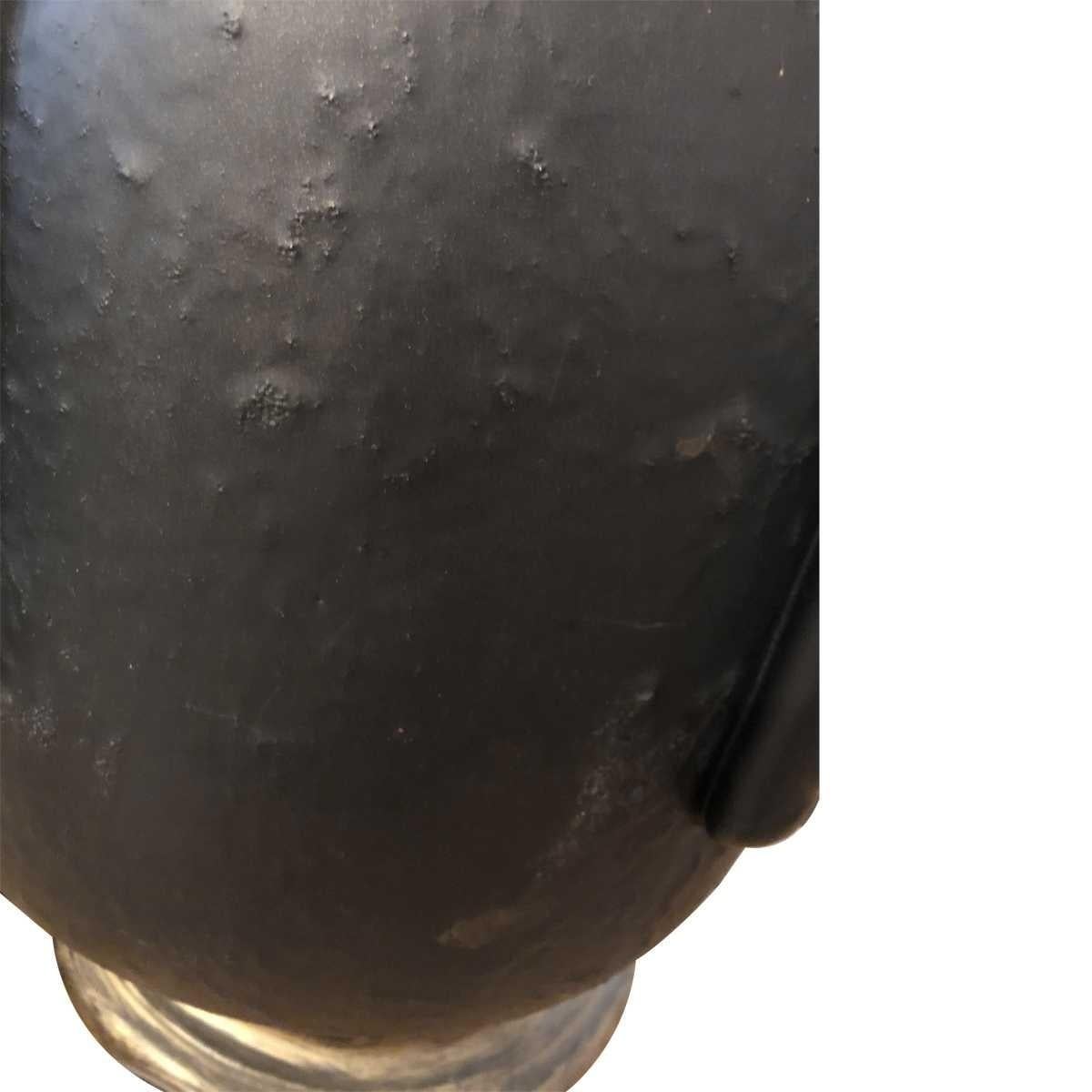 Antiqued black-painted ceramic.
Brass fittings.
Burnished brass-finish metal base

Dimensions
Height 22