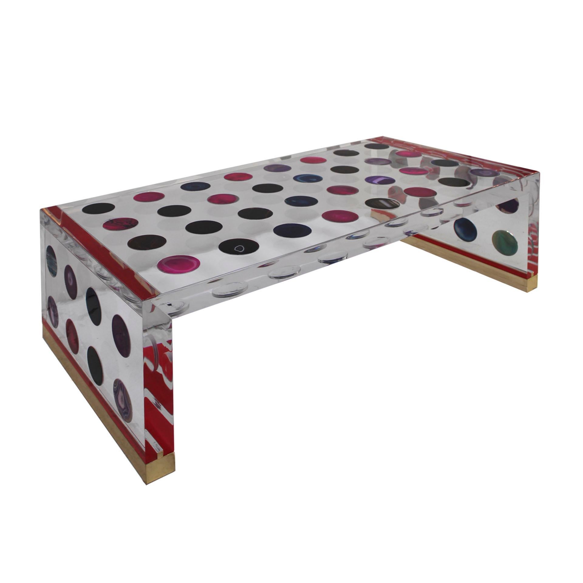 A stunning rectangular shape coffee table designed by Milanese Studio Superego. Made in plexiglas of ten centimeters thickness and surface inlaid decorated with agates. Brass finials on feet. Edition 1/1, Italy.

Agates are natural stones and
