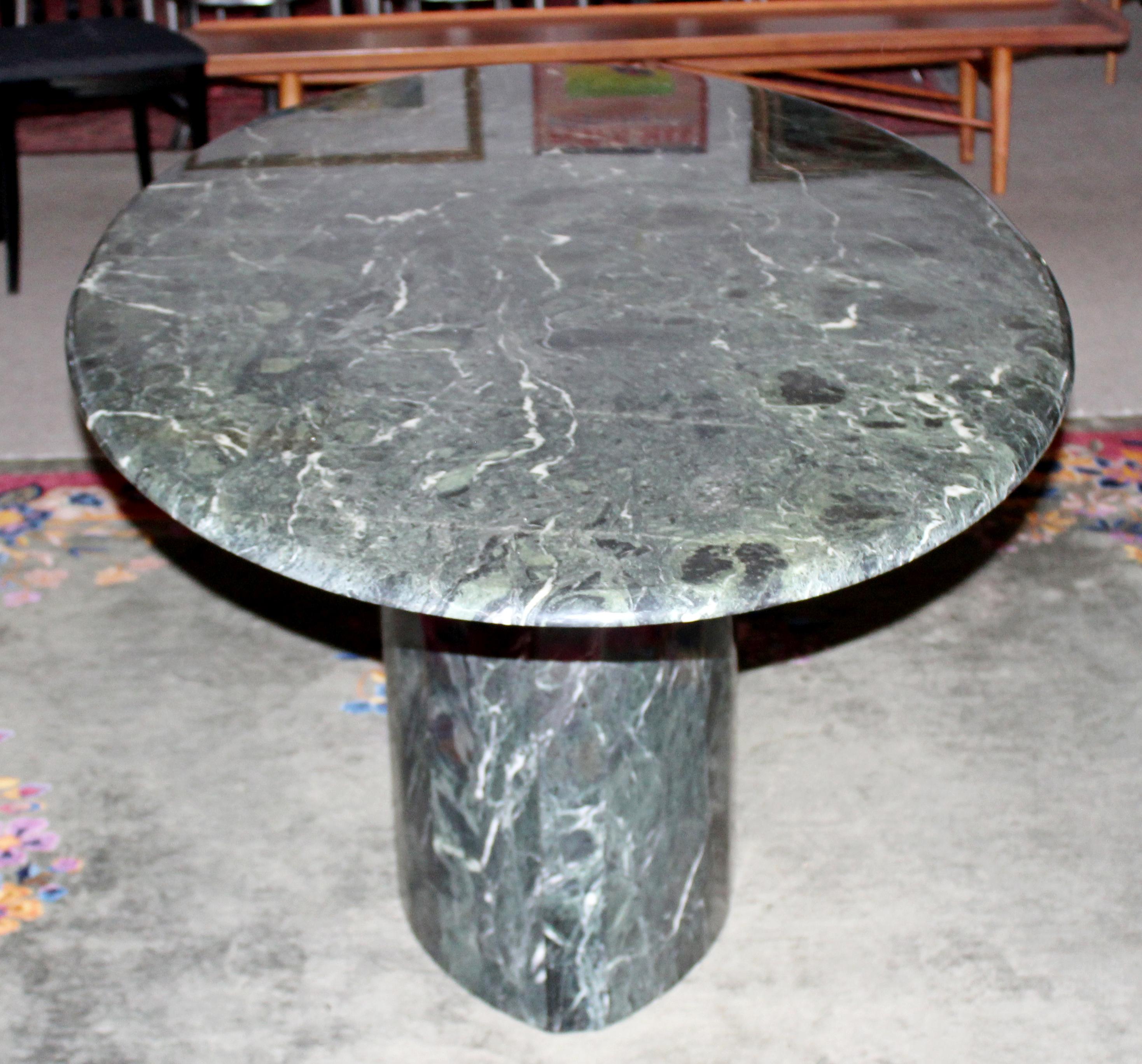 For your consideration is an absolutely incredible, oval shaped, marble dining table, made in Italy, circa 1980s. In excellent vintage condition. The dimensions are 78