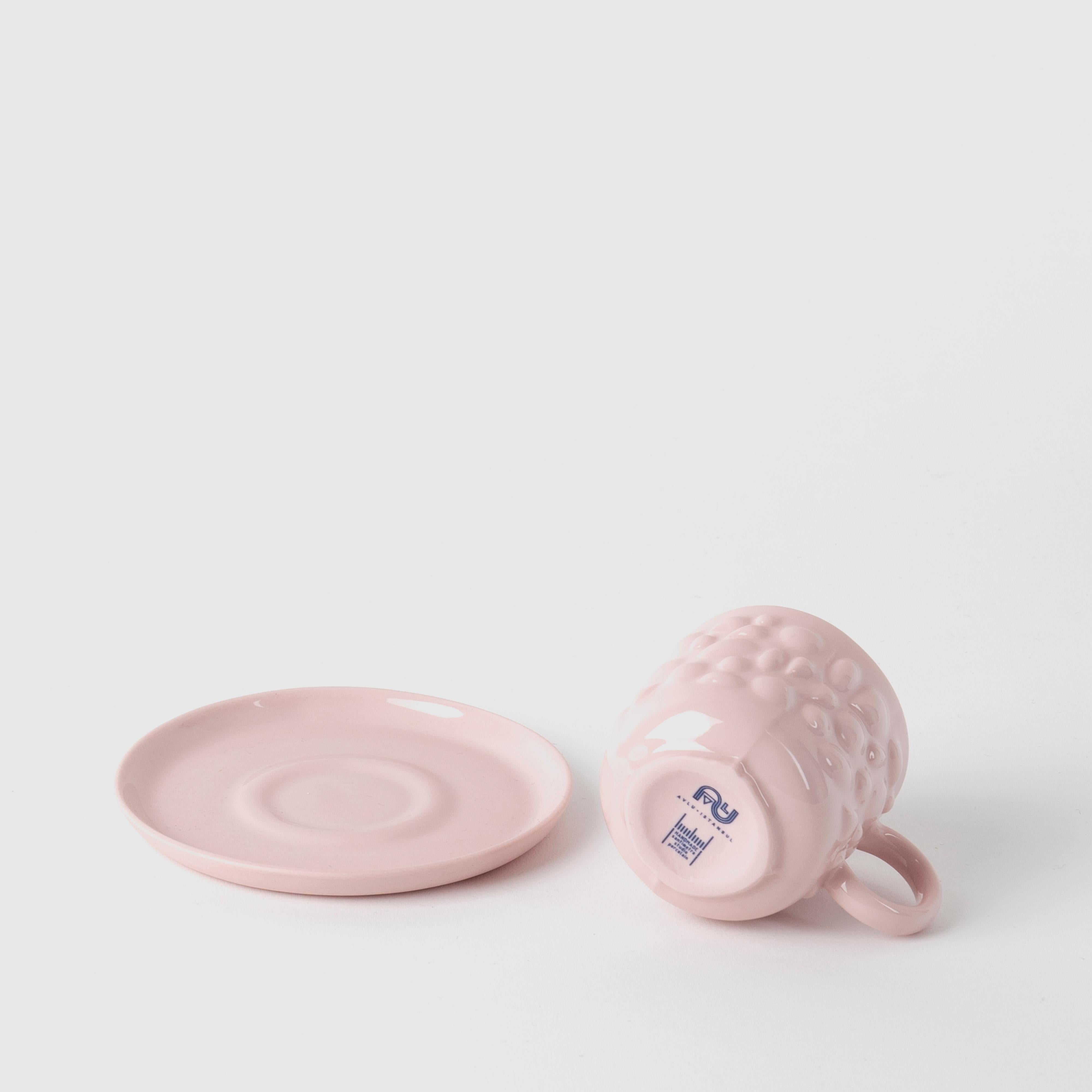 Justine porcelain pieces are inspired by the ancient Byzantine jewelry. Delicate porcelain transforms cups into timeless design objects by translating pearl and stone details of jewelry into flowing forms.

With their pastel colors and delicate