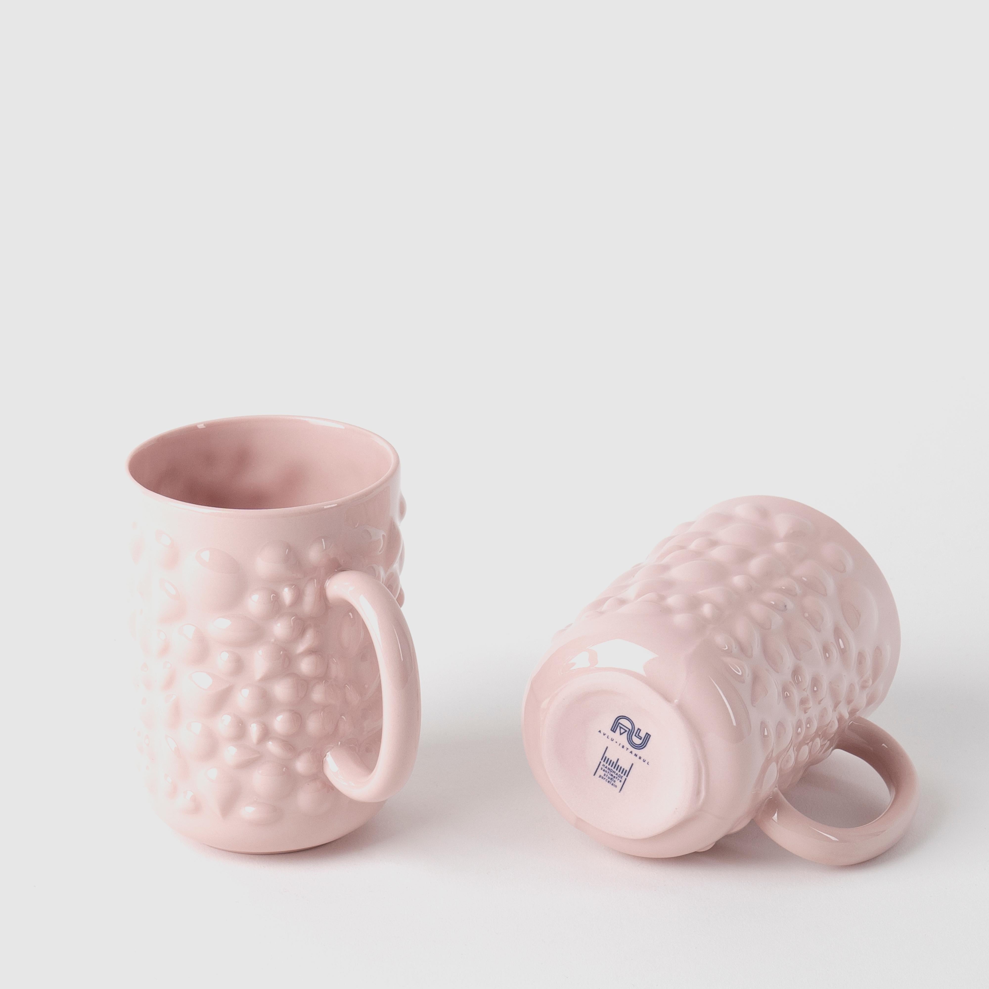 Justine porcelain pieces are inspired by the ancient Byzantine jewelry. Delicate porcelain transforms cups into timeless design objects by translating pearl and stone details of jewelry into flowing forms.

With their pastel colors and delicate