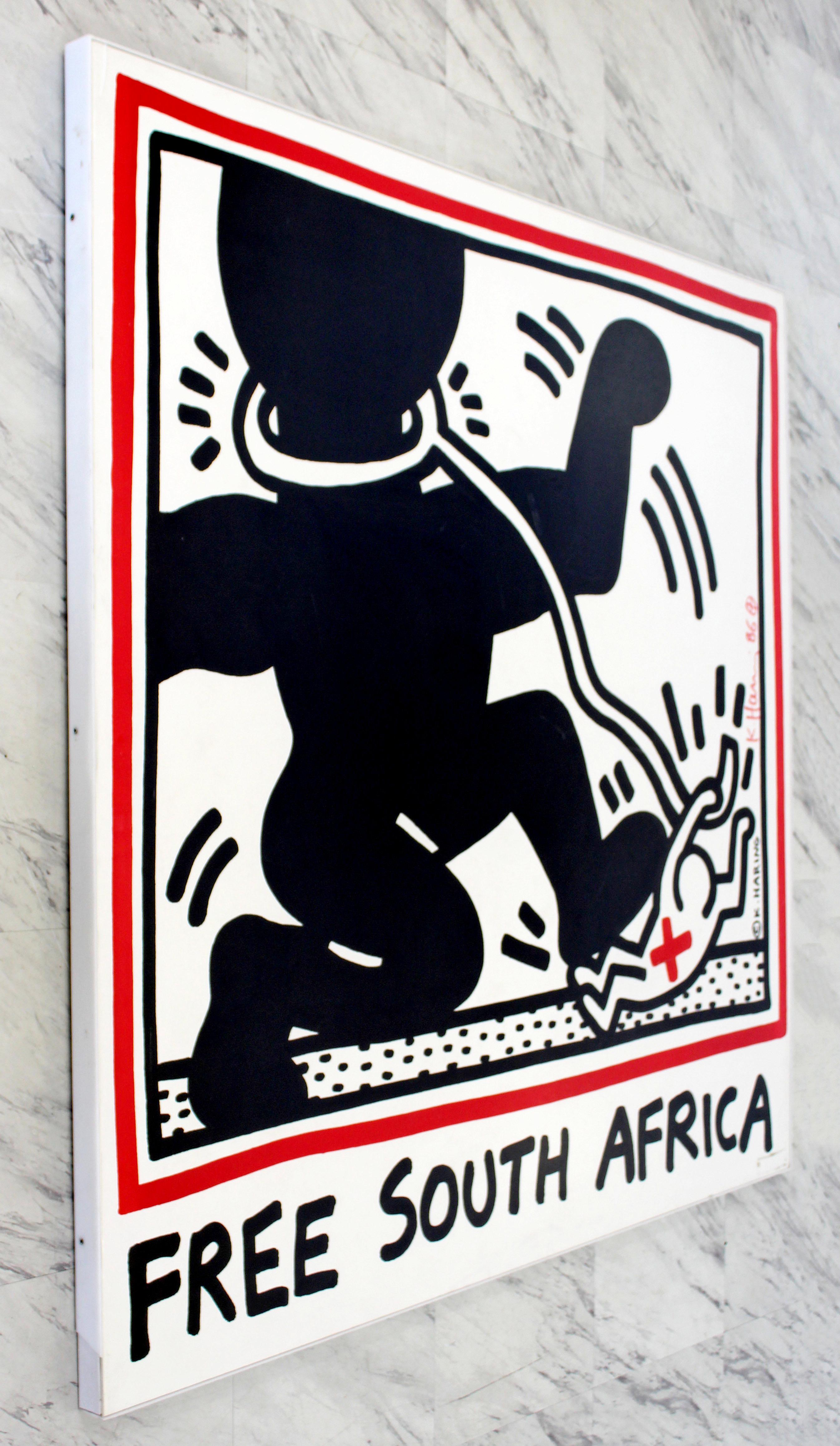 For your consideration is a phenomenal, Lucite framed, Free South Africa Limited Edition by Keith Haring, signed and dated 1986. Artwork is in excellent condition, but the frame is in fair condition. The dimensions are 48