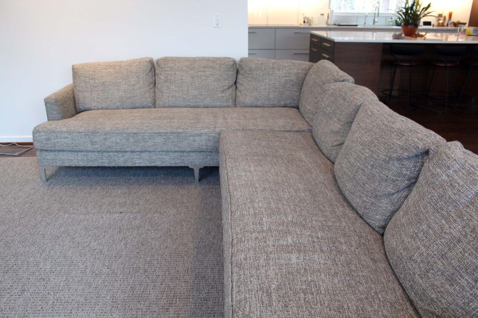 This luxurious Kravet grey sectional is the perfect addition to any living space. This sectional features plush, comfortable cushions and deep seating, perfect for lounging or entertaining. This sectional comes with both medium fill and hard fill