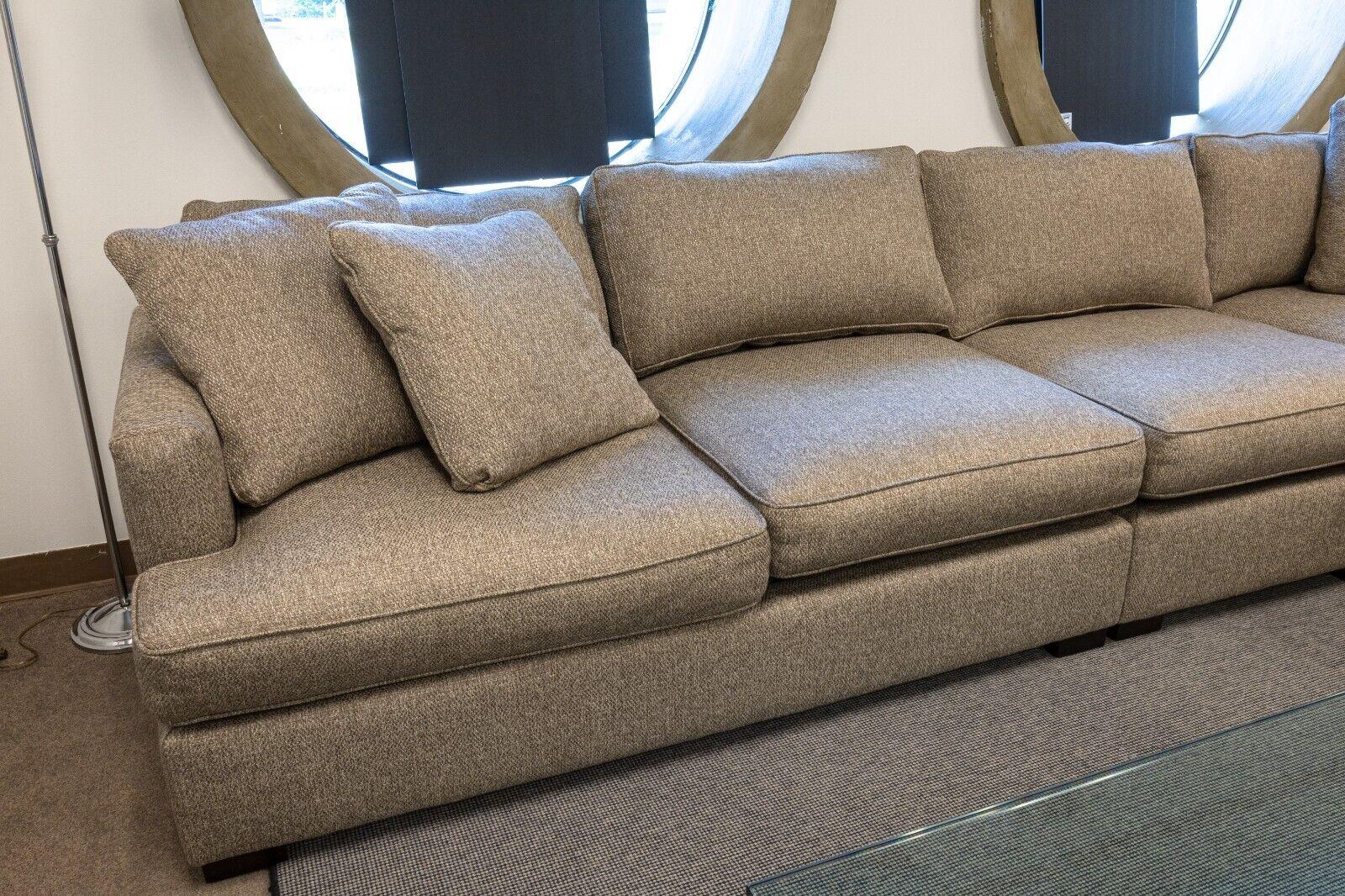A contemporary modern large grey L shaped 3pc sectional sofa by Better By Design for Max Home Furniture. This is a fantastic sofa sectional dressed in a beautiful understated grey upholstery, featuring removable cushions and pillows, a very large