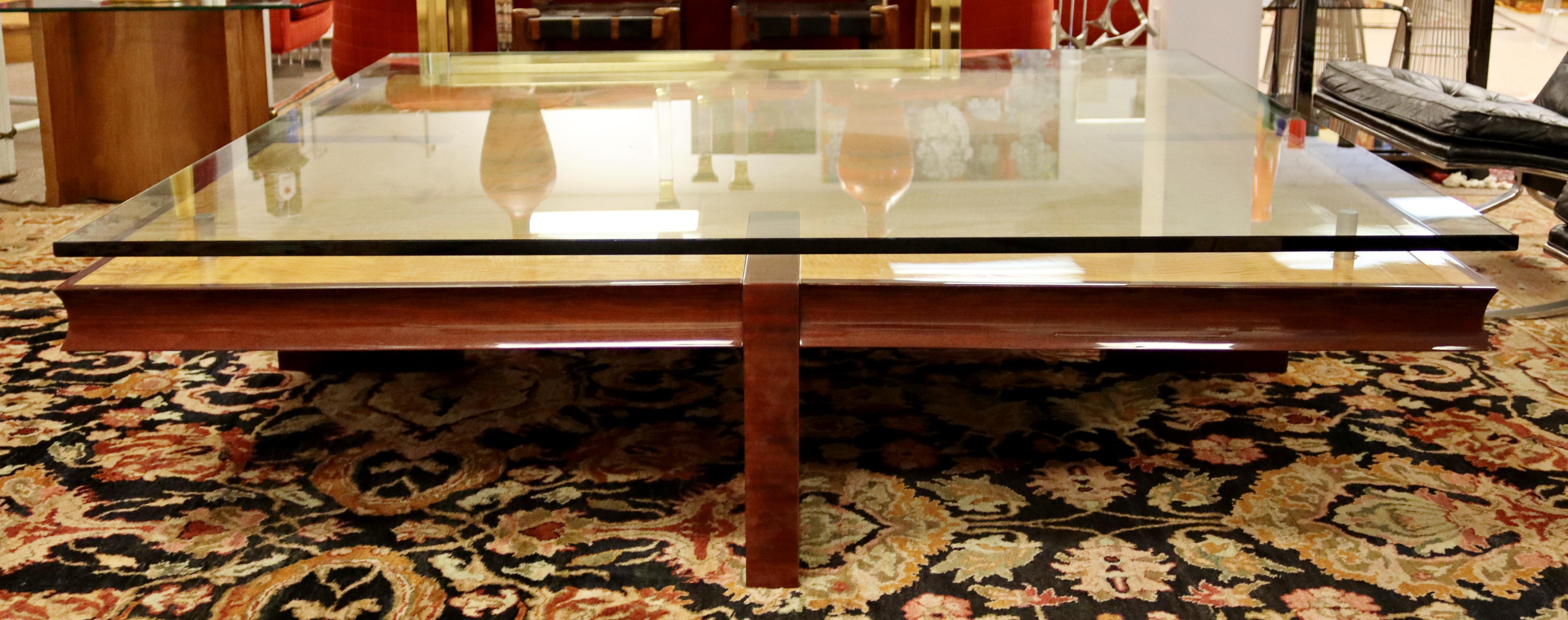 For your consideration is a stupendous and massive, square coffee table, made of burlwood and with a floating glass top, circa the 1980s. In excellent vintage condition, but with a few nicks in the wood. The dimensions are 66