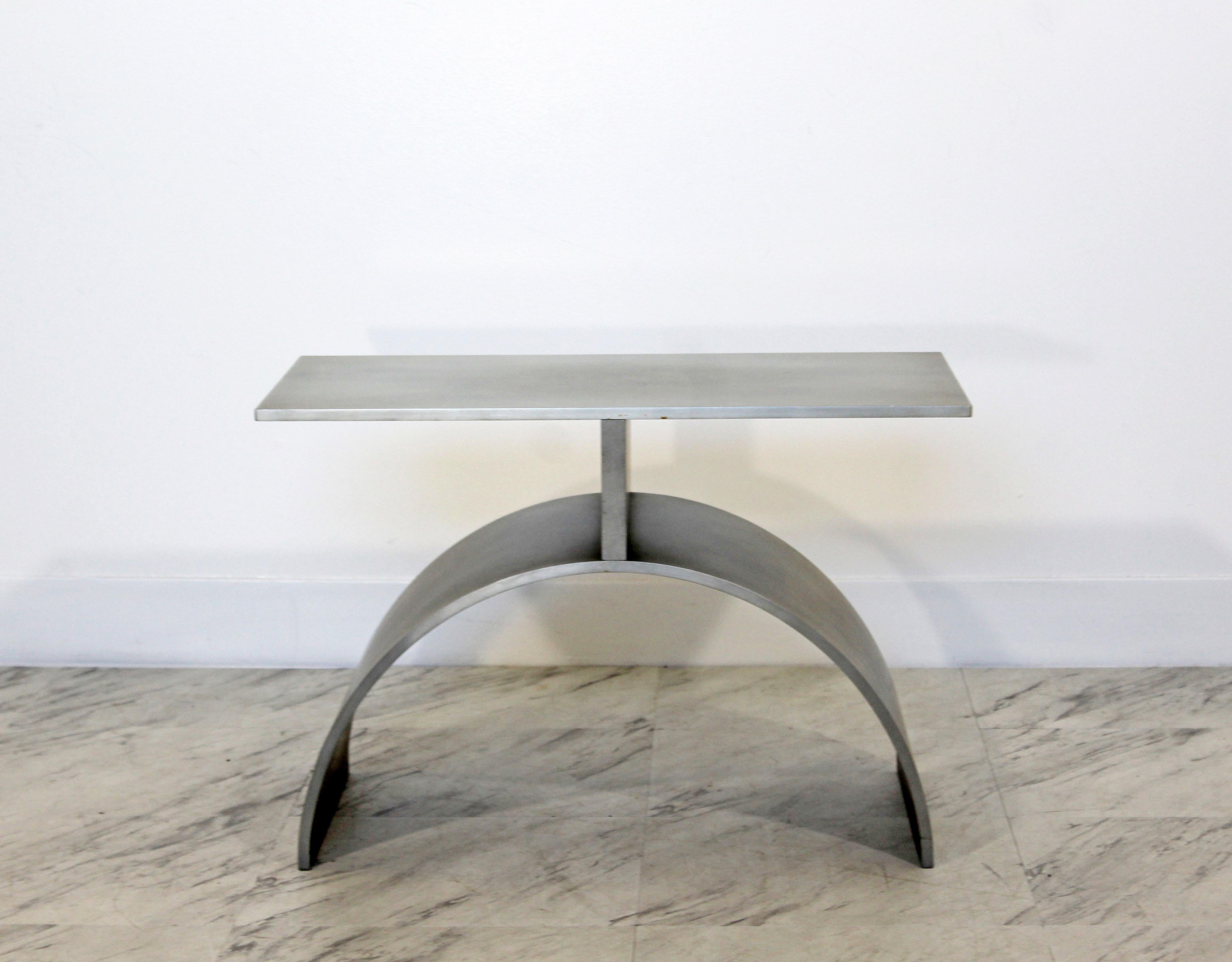 For your consideration is a stunning, brushed aluminum side or end table, attributed to Jonathan Nesci. In excellent condition. The dimensions are 22