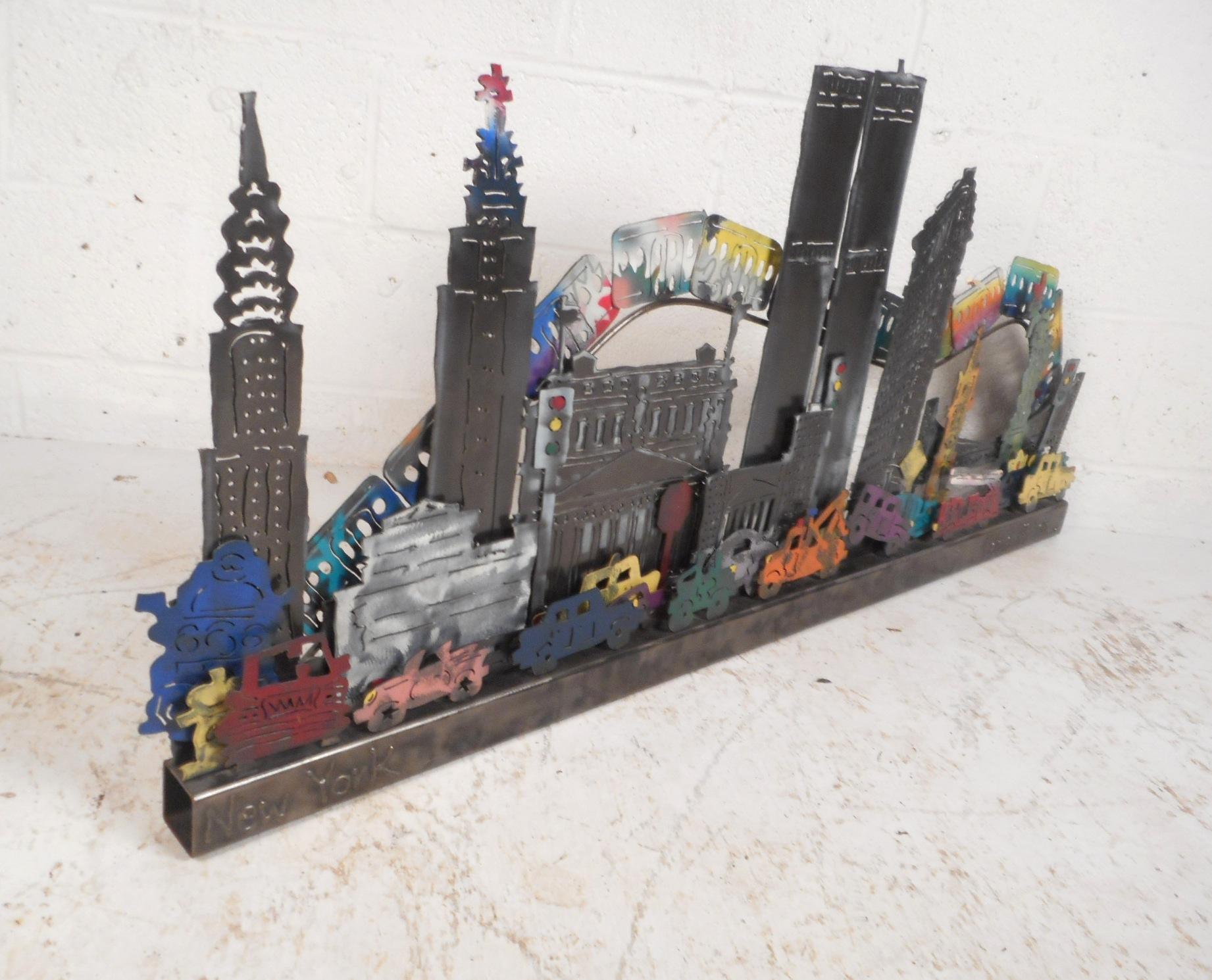 This wonderful contemporary metal wall art displays the New York City skyline with a three dimensional design. A fabulous sculptural and colorful piece signed 