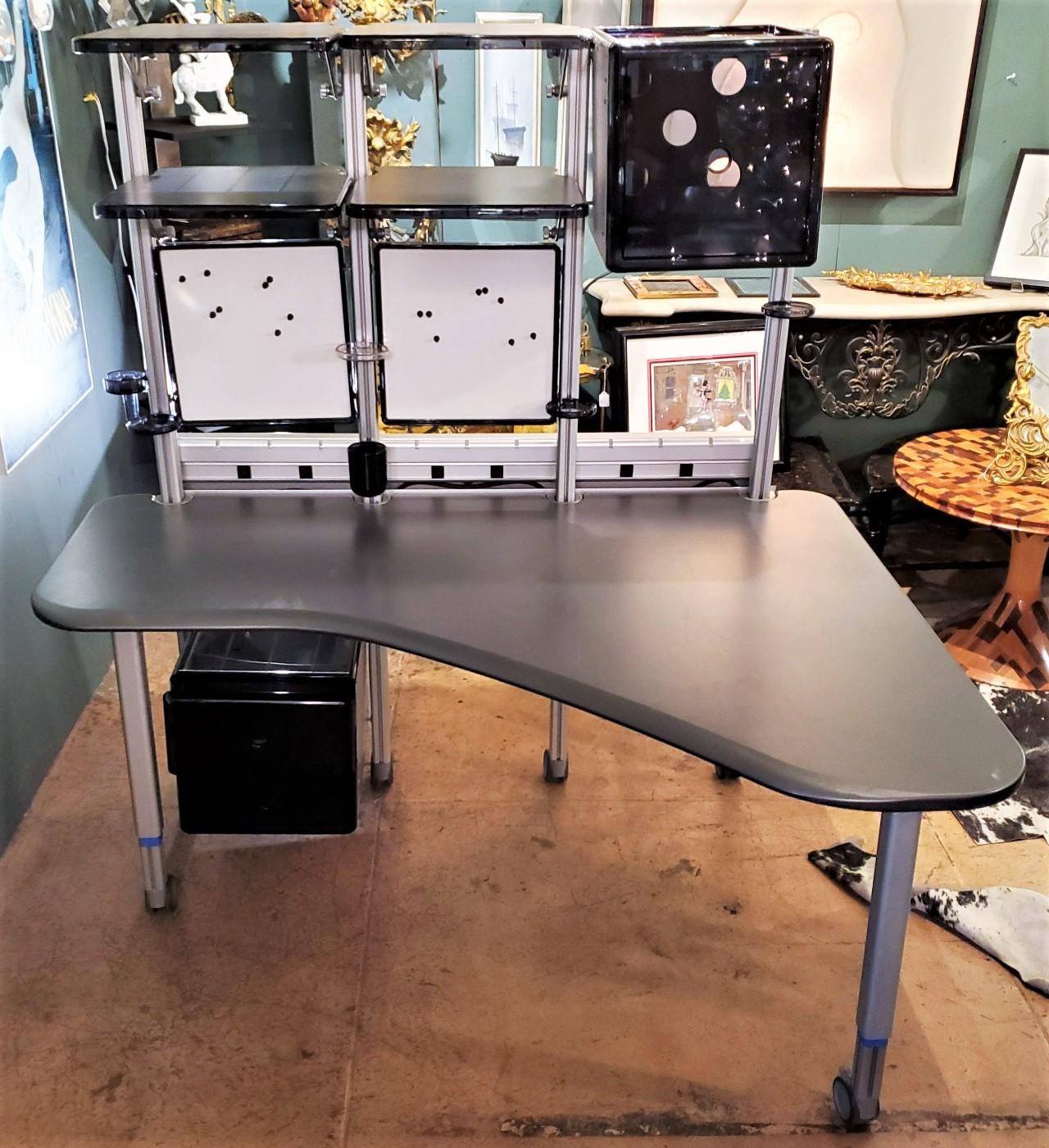 Award winning designer Richard Hollbrook designer for Herman Miller
Modern shelved desk with well thought out placement for the busy worker.

Measures: Table height is 29.5.