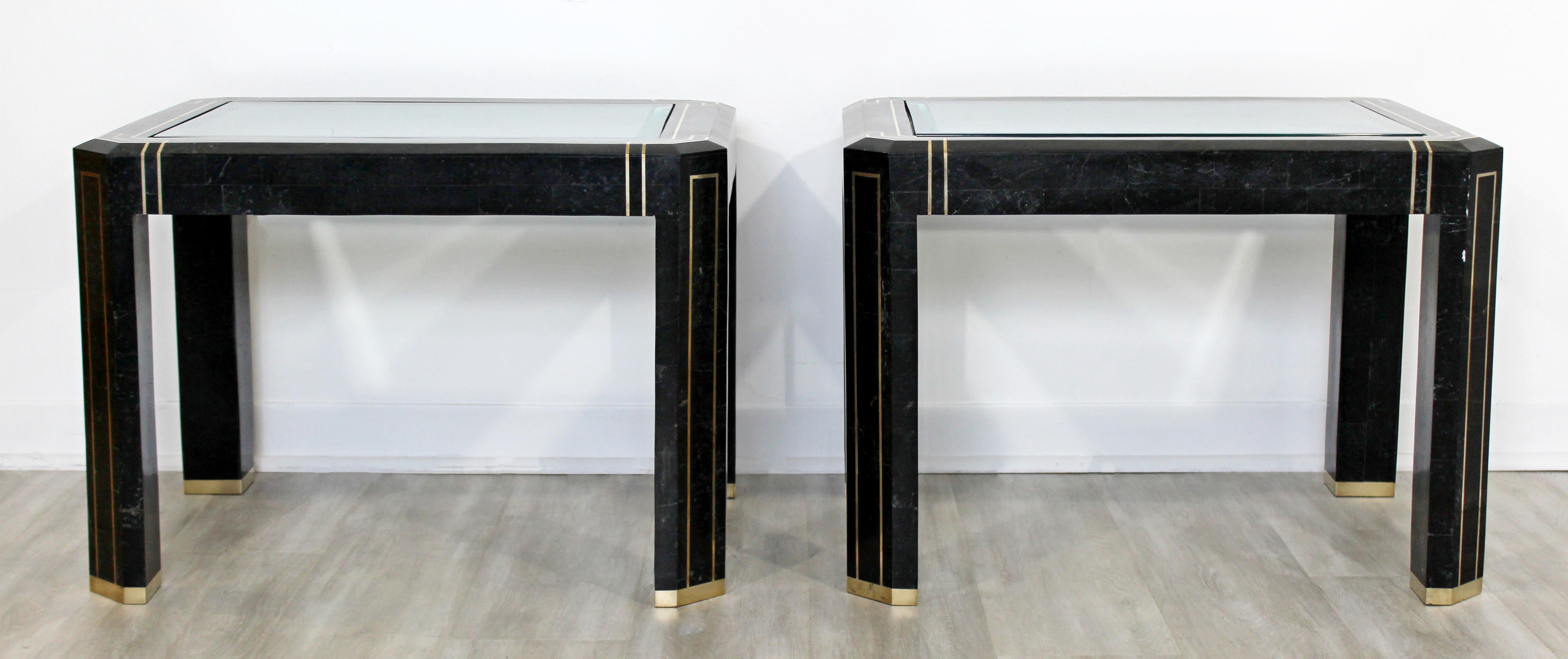 For your consideration is a pair of incredible, side or end tables, made of tessellated stone and with glass tops, by Maitland Smith, circa 1980s. In very good vintage condition, with a chip in the glass and a chip in the brass at one of the feet.