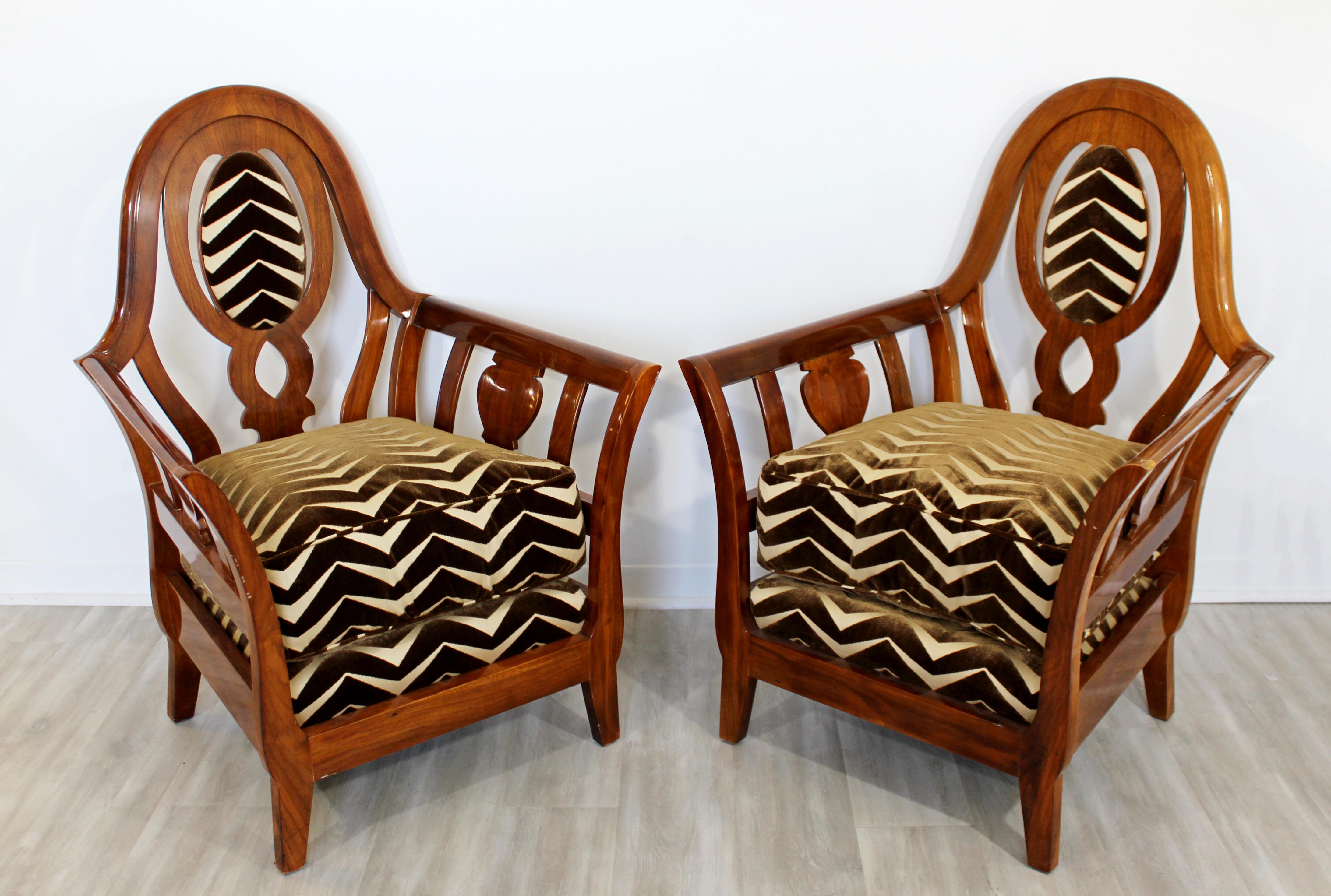 For your consideration is an exceptional pair of Art Deco style lounge armchairs, with a zebra print velvet upholstery on plush seats, on curved lacquered wood bases. In great condition. The dimensions are 32