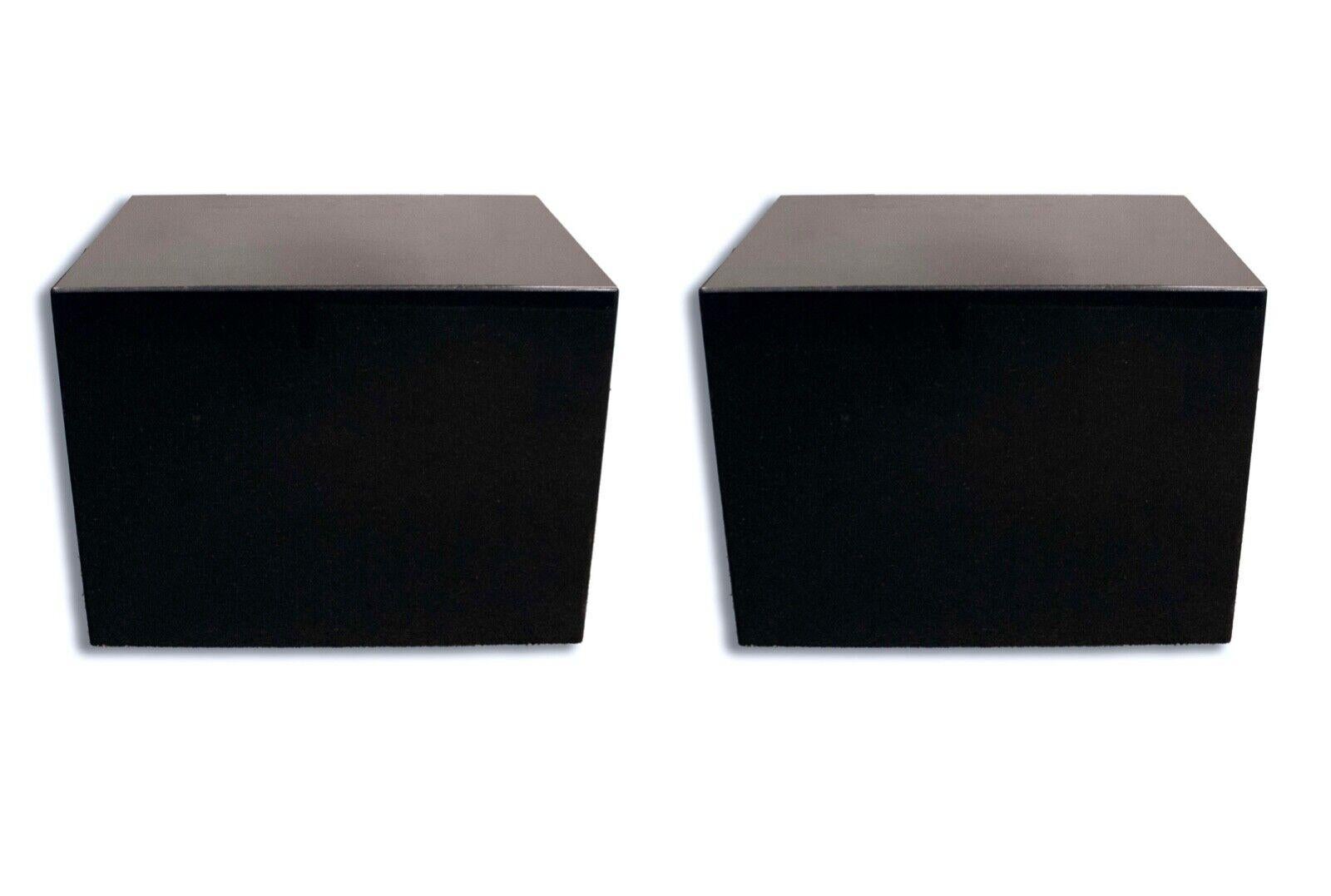 Introducing a pair of exquisite black granite end cube tables that exude sophistication and modernity. These tables are crafted from high-quality black granite, known for its durability and timeless elegance. With their clean lines and minimalist