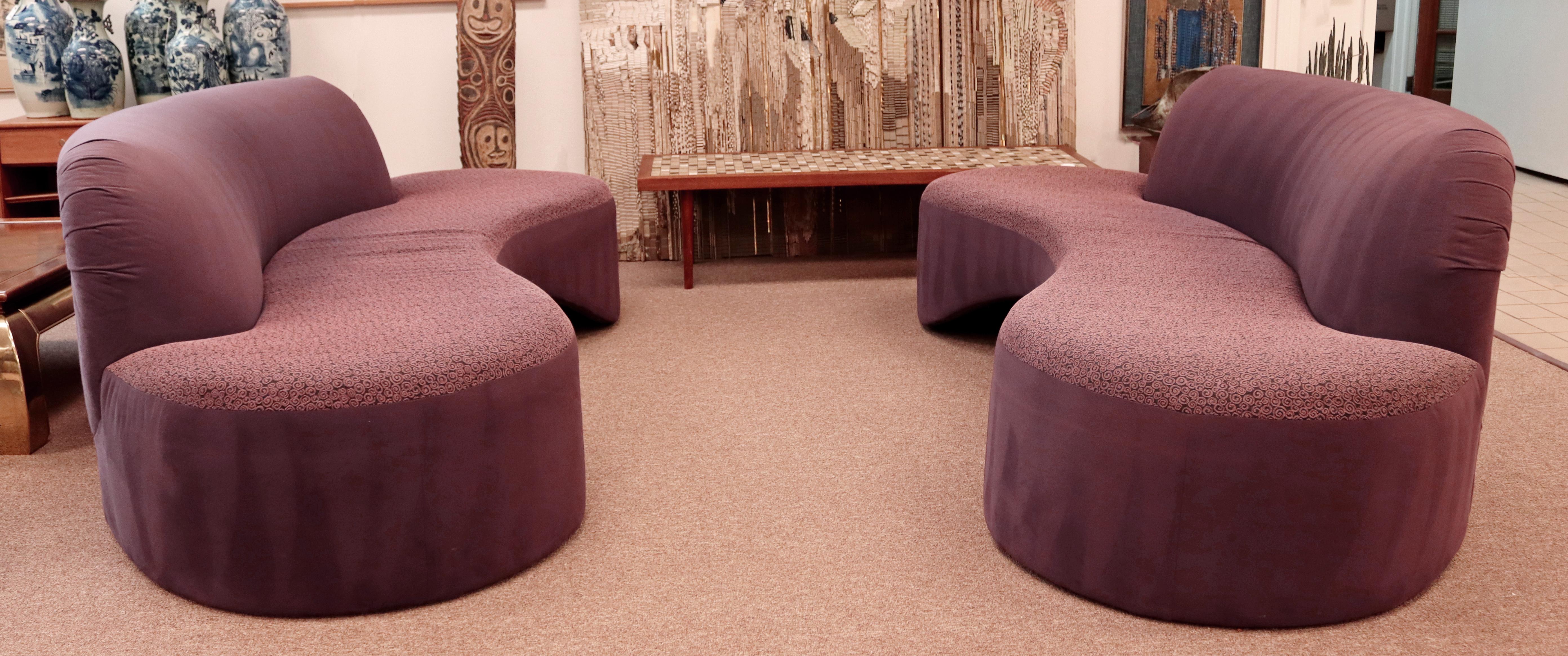For your consideration is a breathtaking pair of curved, serpentine sofas, circa the 1980s. In excellent vintage condition. Because of lighting doesn't quite show the true color, these are purple. The dimensions of each are 94