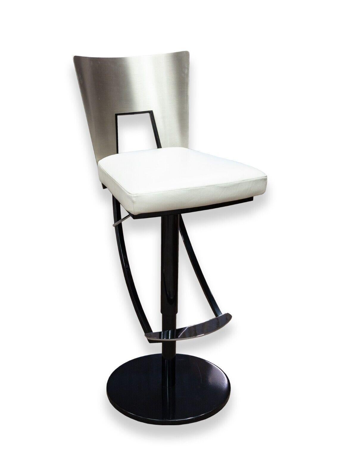 A contemporary modern pair of Elite Modern black and white barstools. A delightful set of barstools from Elite Modern. These two bar stools feature a full metal construction with black and brushed steel elements, white leather cushions, swiveling