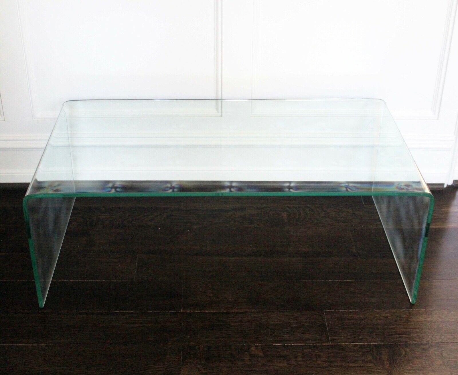 For your consideration is this stunning pair of solid single sheet glass waterfall coffee Cocktail Tables. Dimensions: 39w x 21.75d x 13.5h.
 
