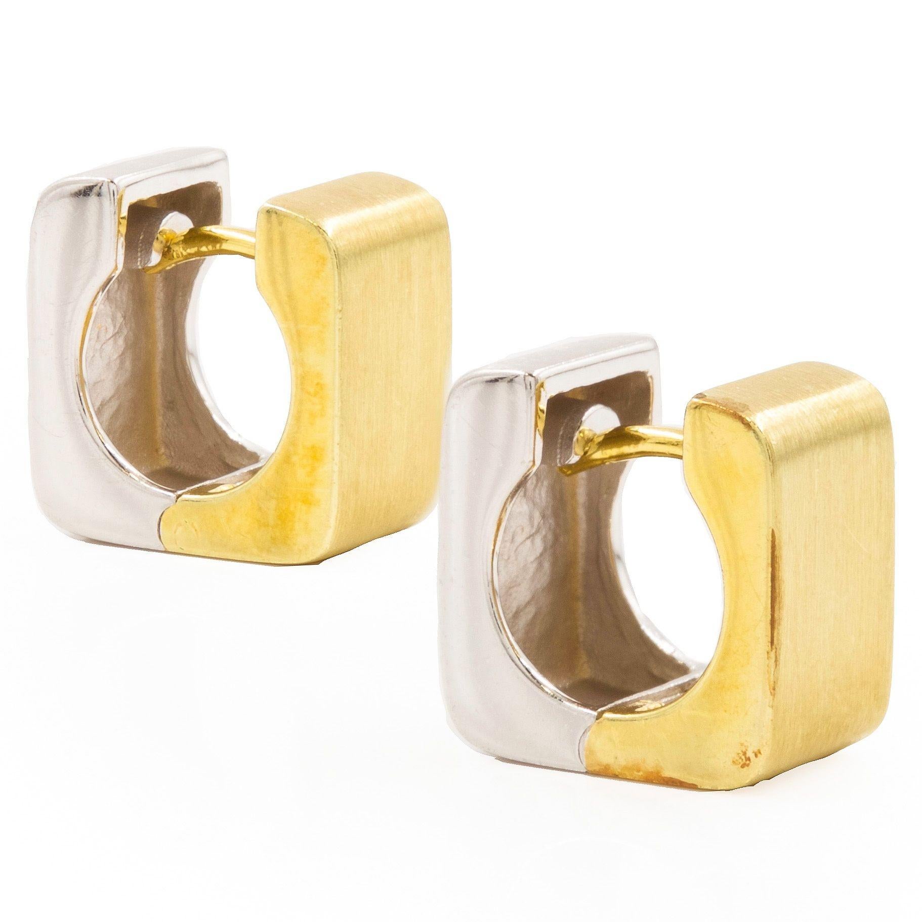 CONTEMPORARY PAIR OF WHITE-AND-YELLOW 14K GOLD HUGGIE EARRINGS
Item # 204EJC14P 

A gorgeous pair of huggie earrings executed entirely in 14 karat gold, both the yellow and white gold sides feature a beautiful brushed finish. The two halves join in