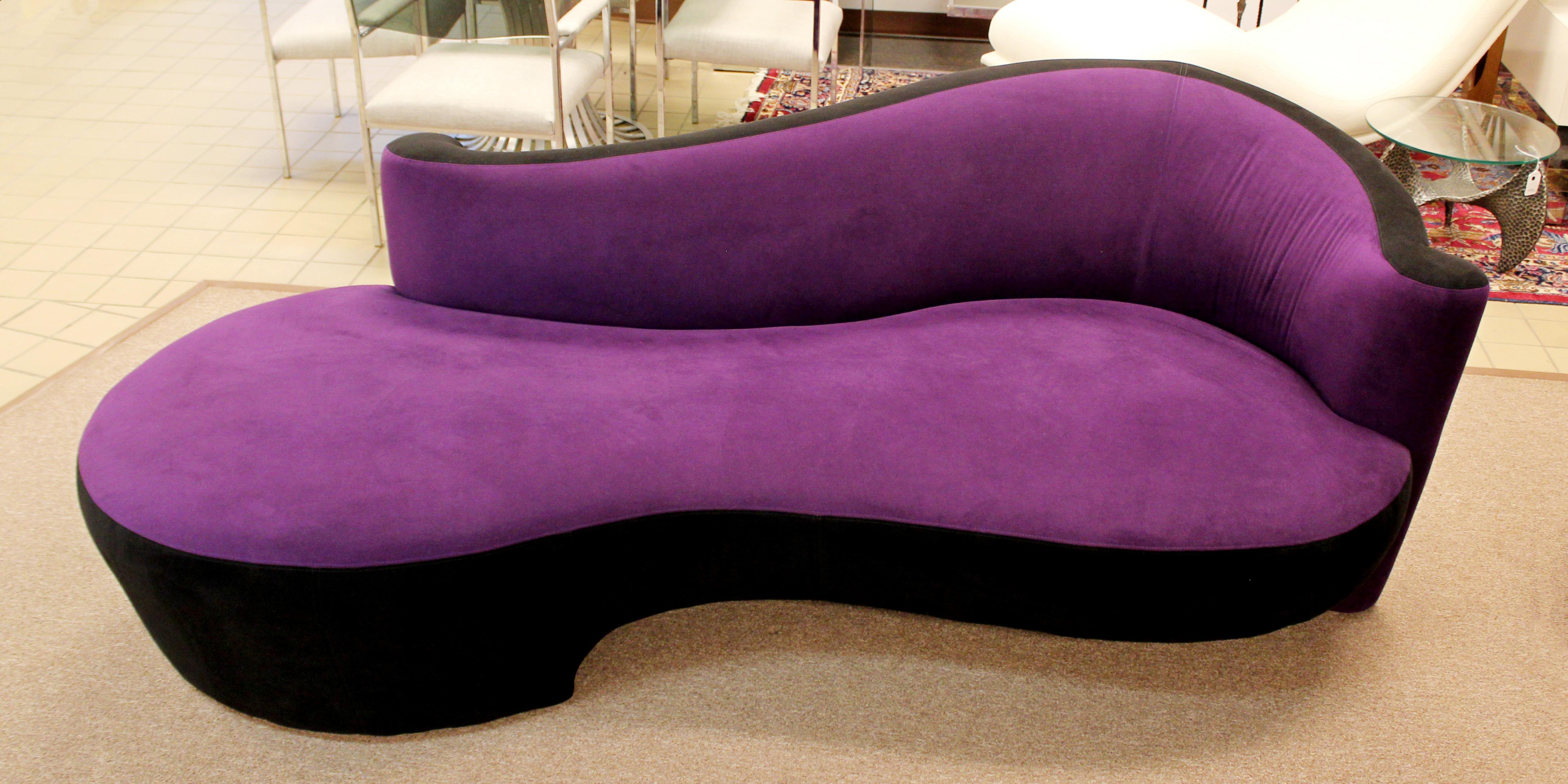 For your consideration is an outstanding pair of purple micro- suede, serpentine sofas, with a matching ottoman, by Weiman, circa the 1980s. Though the fabric looks pinky in some of the pictures, this is due to lighting issues, in life, it is a deep
