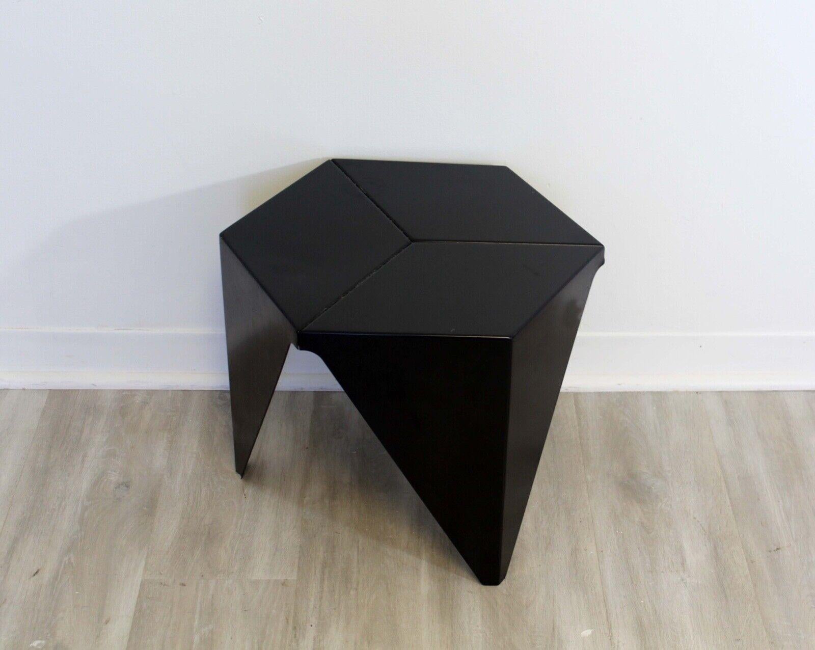 Le Shoppe Too presents this lovely table. Inspired by traditional Japanese paper folding techniques, modern designer Isamu Noguchi gave the Prismatic Table a pure geometric design. The three-legged side table, which is evocative of a prism. In good