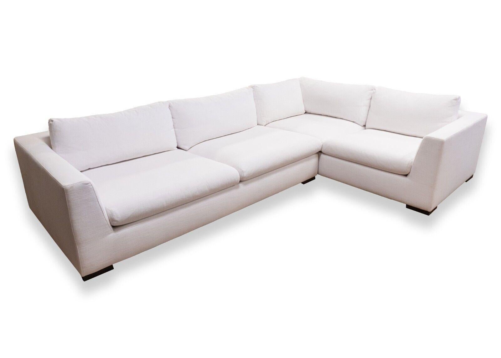 A Restoration Hardware bright white two piece sofa sectional. This stunning couch from Restoration Hardware boasts a very clean, bright white upholstery with fine stitching. This sofa sectional comes in a two piece design. The two pieces are