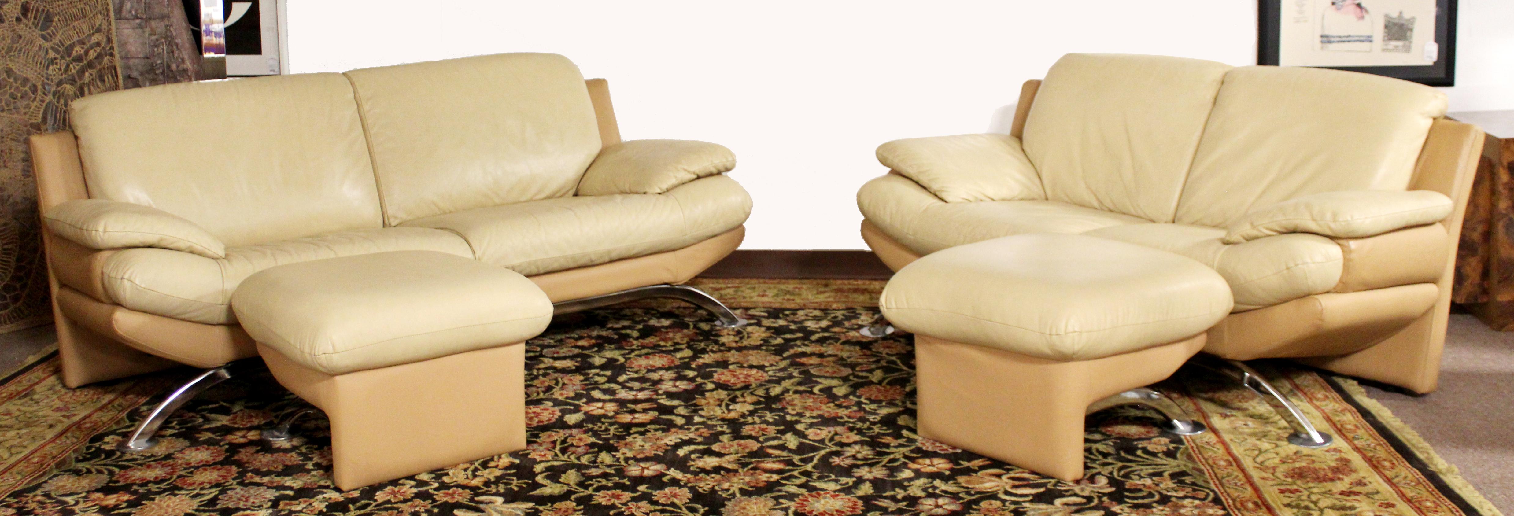 For your consideration is an incredible sofa and loveseat set, with a pair of ottomans, by Roche Bobois, circa 1980s. These pieces are upholstered in beige leather, with chrome legs. In excellent vintage condition. The dimensions are of the loveseat