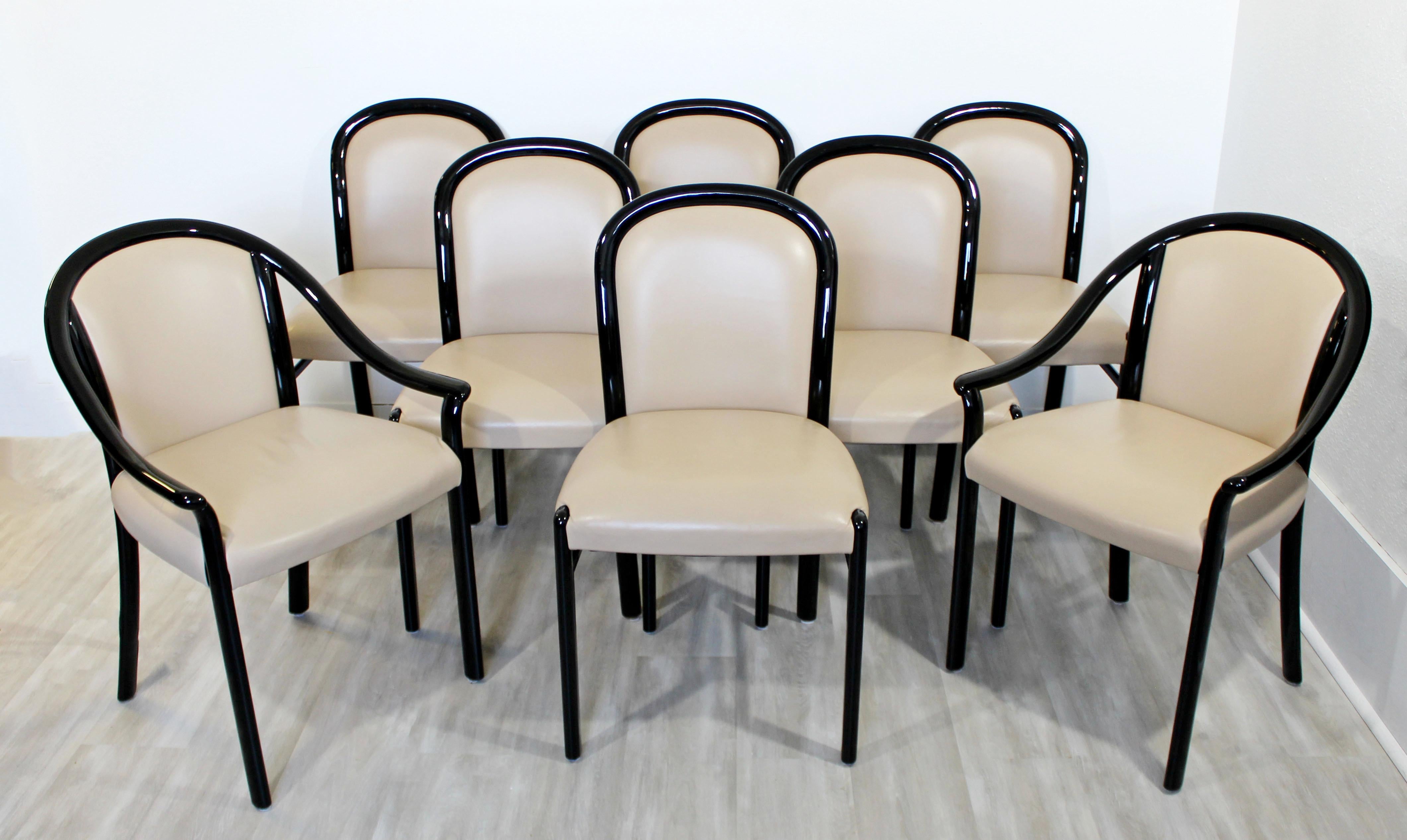 For your consideration is a spectacular set of eight, beige leather and black lacquer wood, curved dining chairs, including six side and two armchairs, circa 1980s. In excellent condition. The dimensions of the armchairs are 23