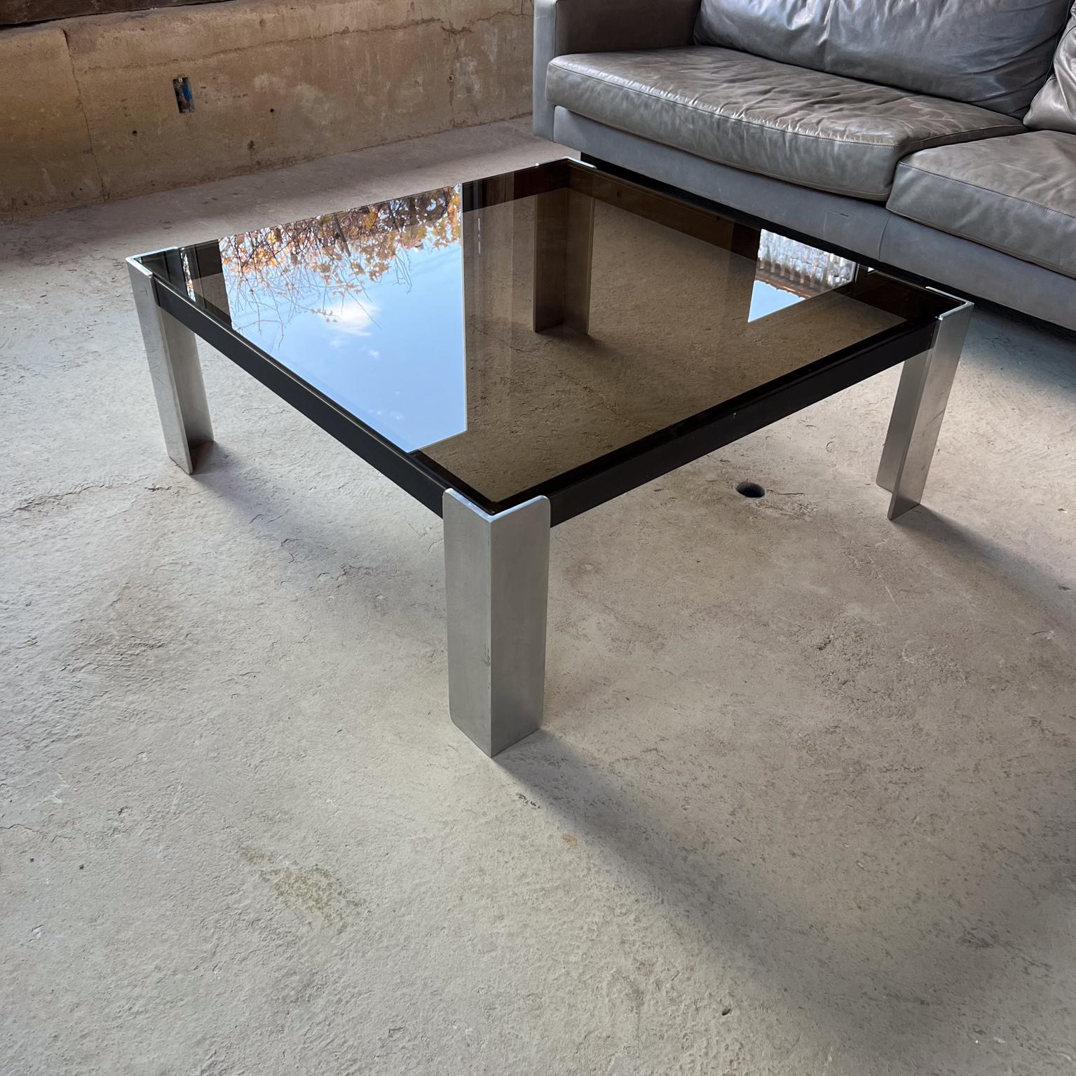 Contemporary Modern Square Coffee Table after Milo Baughman
Aluminum 
in the style of Milo Baughman
Unmarked
15.75 h x 40 x 40
Original unrestored vintage condition.
Please see images provided.
(also offering a matching console table).