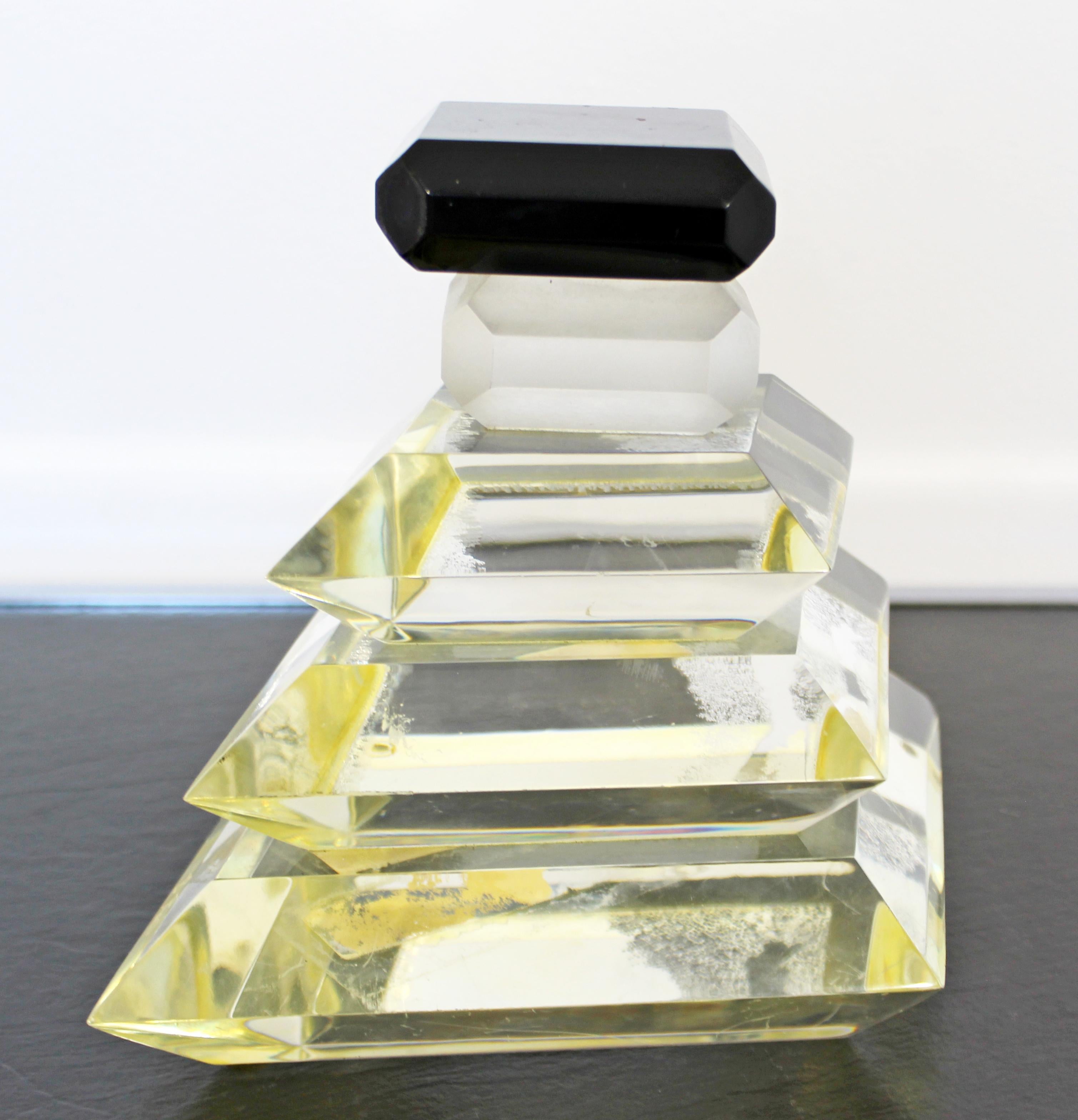 For your consideration is a simple and chic, perfume bottle table sculpture, made of thick Lucite, signed B. Rich, circa 1980s. In very good condition. The dimensions are 9