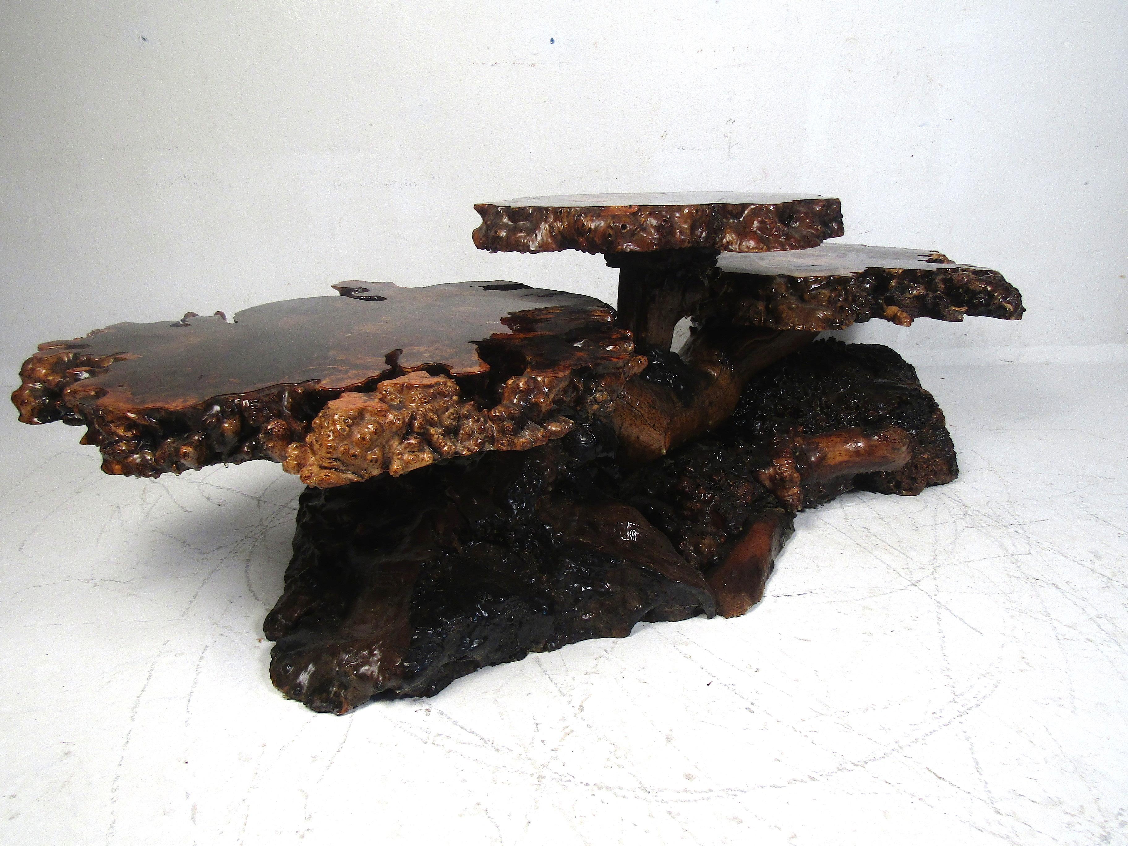 Very unusual contemporary table with three tiers of tree slab tabletops. A colorful resin epoxy fills the gaps within the slabs, and there is a lacquered finish applied on top of that. The uppermost tier is about 19 inches tall, and the two lower