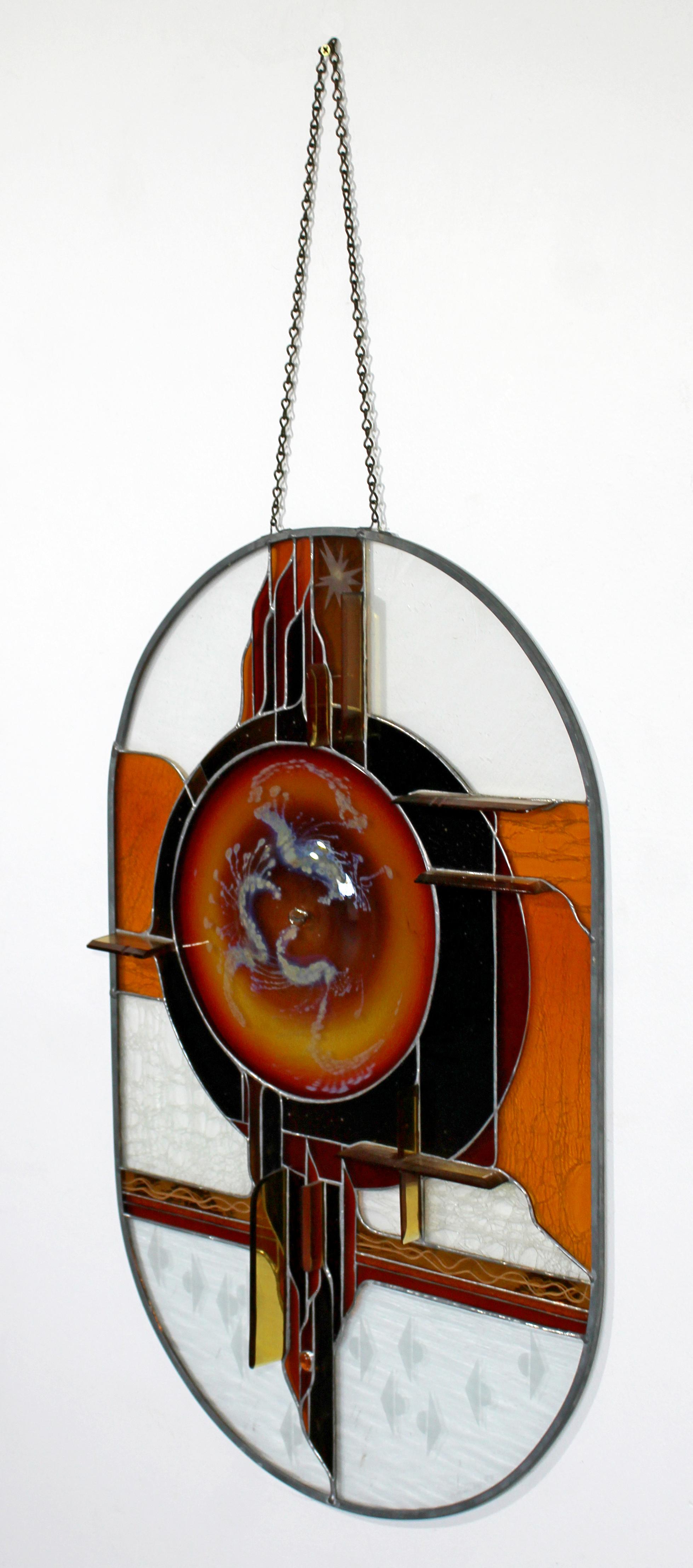 For your consideration is a magnificent, stained glass, hanging art sculpture, by Toland Sands, circa the 1980s. In excellent condition. The dimensions are 17.5