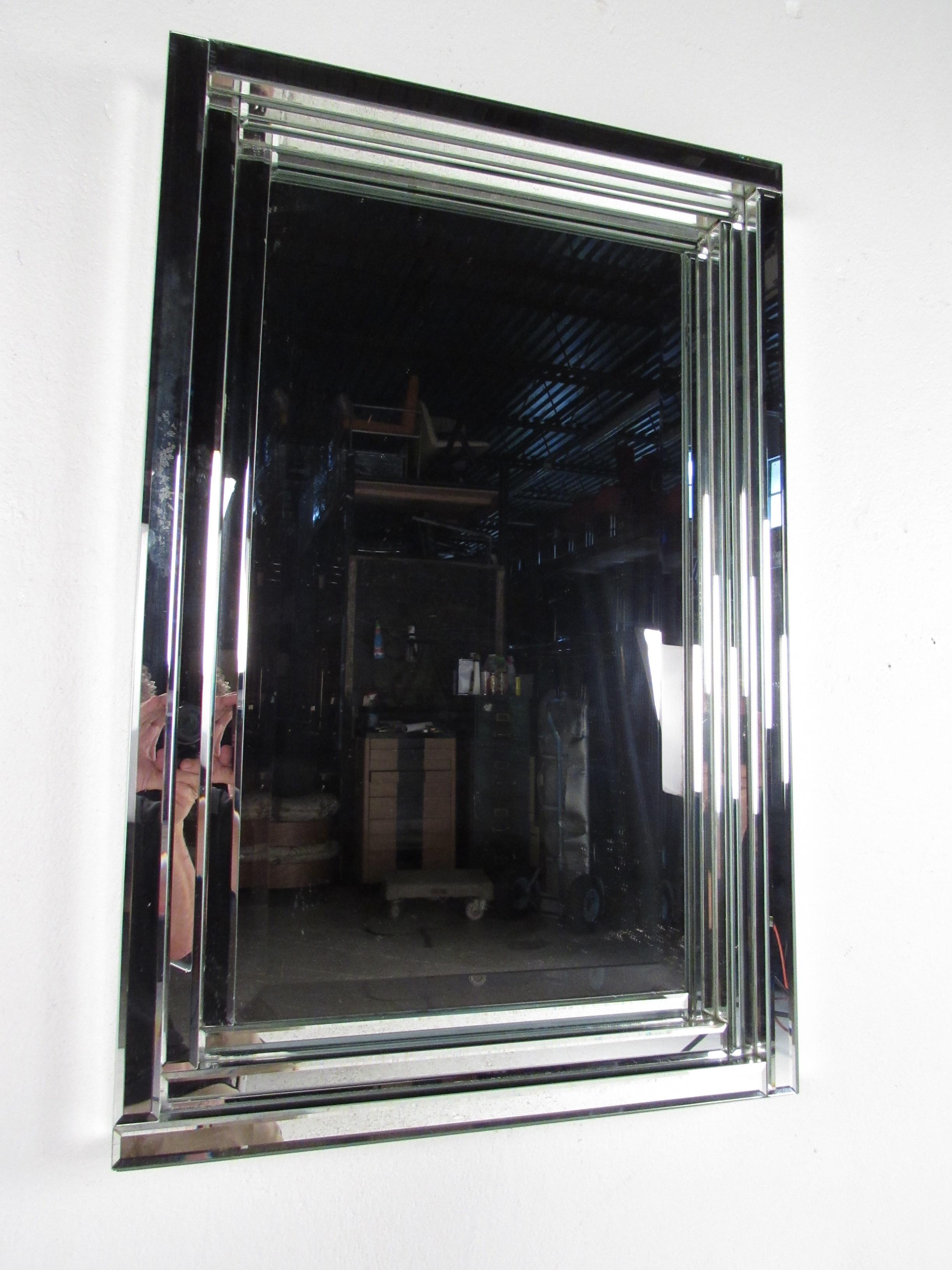 This beautiful midcentury style mirror features bevelled edge frame and makes a striking wall hanging mirror for home or business. Please confirm item location (NY or NJ).