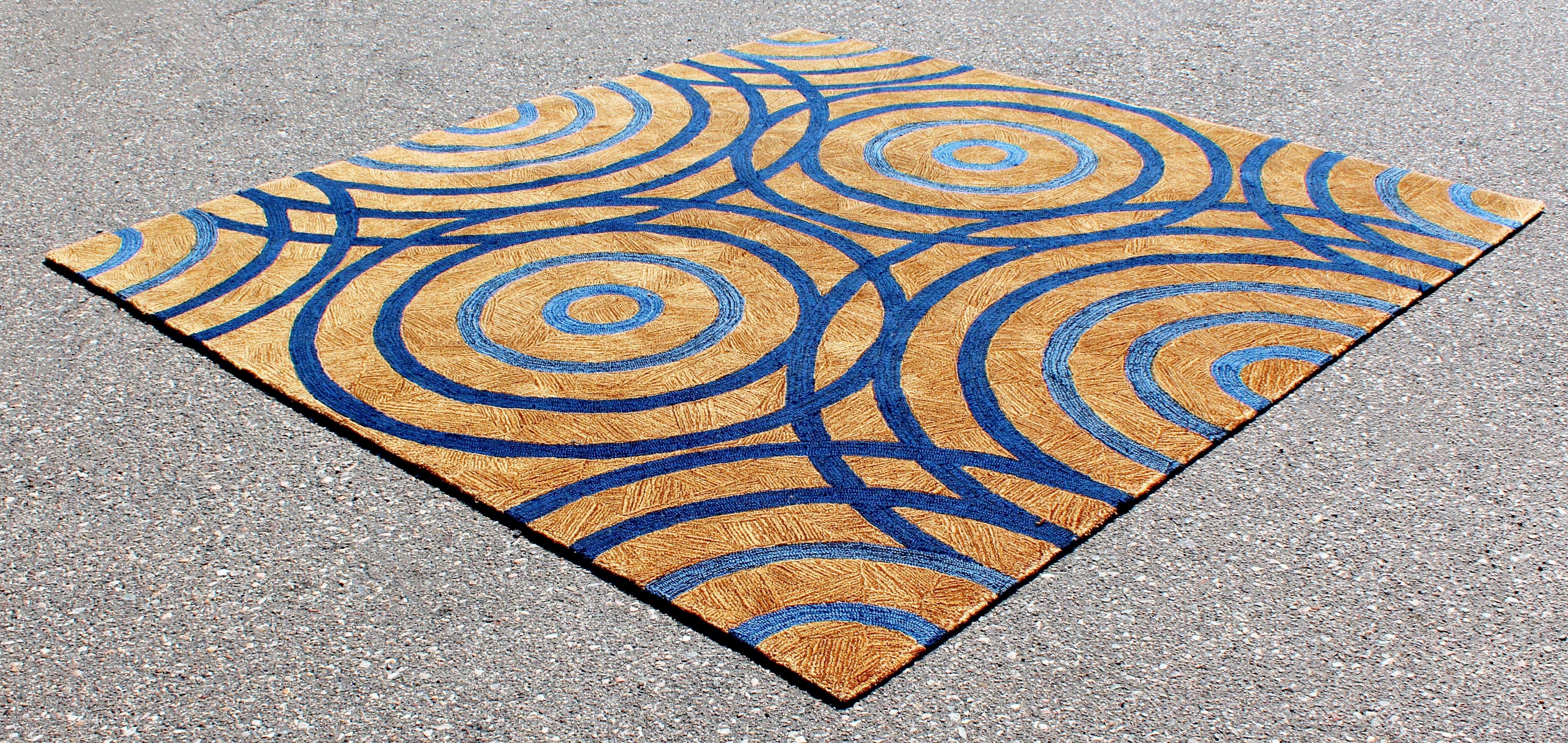 For your consideration is an impressive, 100% wool area rug or carpet, with a geometric brown and blue pattern, signed by Edward Fields, circa 1999. In excellent condition. The dimensions are 97