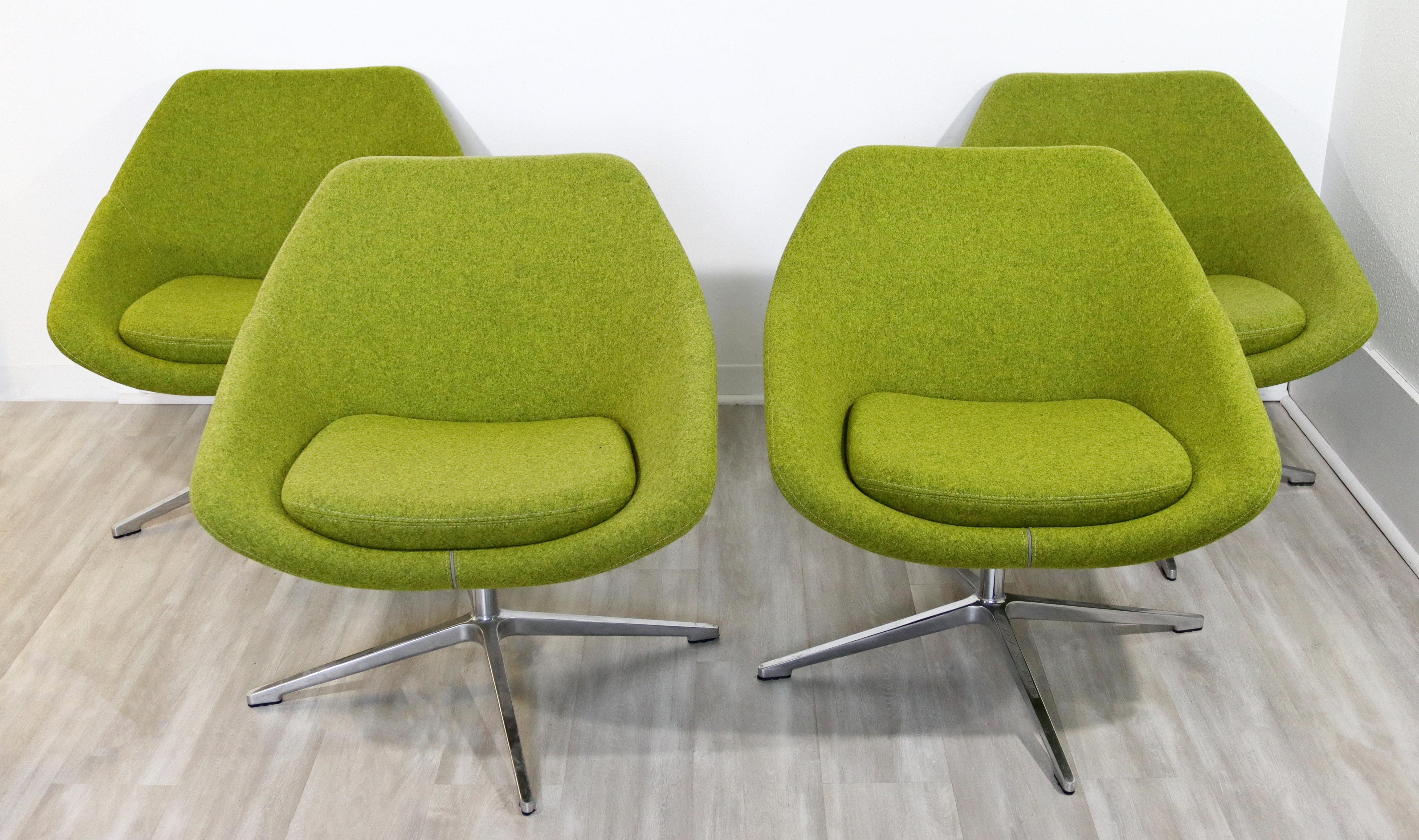 For your consideration is a gorgeous set of four lounge chairs on chrome bases, by Allermuir, circa 2013. In excellent condition. The dimensions are 29