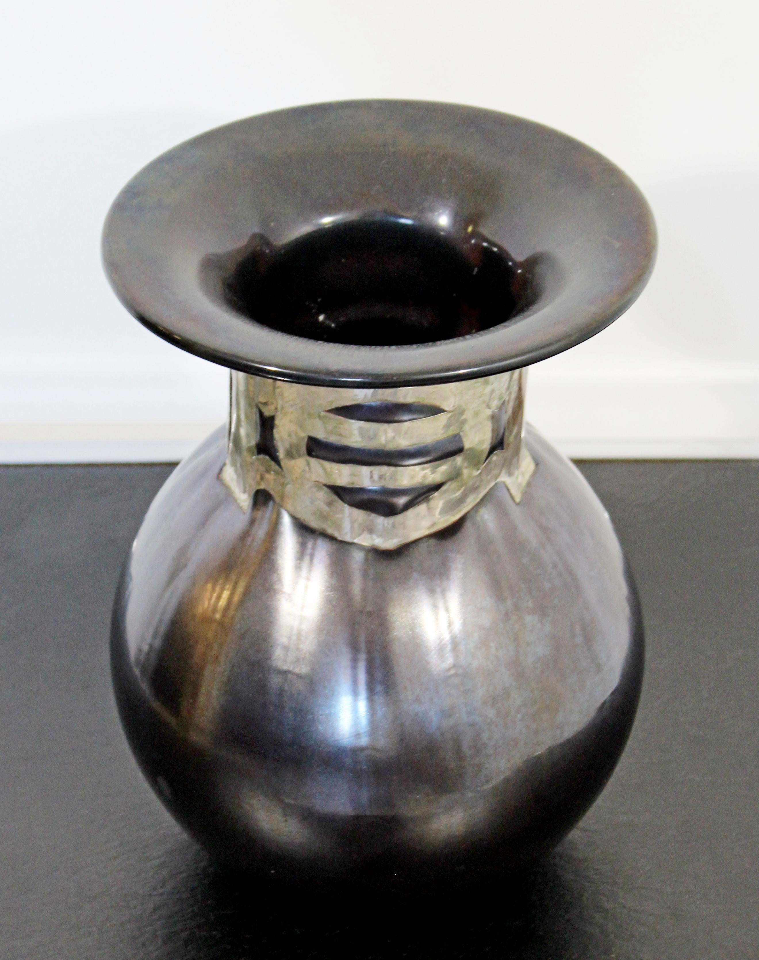 For your consideration is a stunning glass art vase, with an artistic metal neck, signed on the base by Anthony Stern. In excellent condition. The dimensions are 8