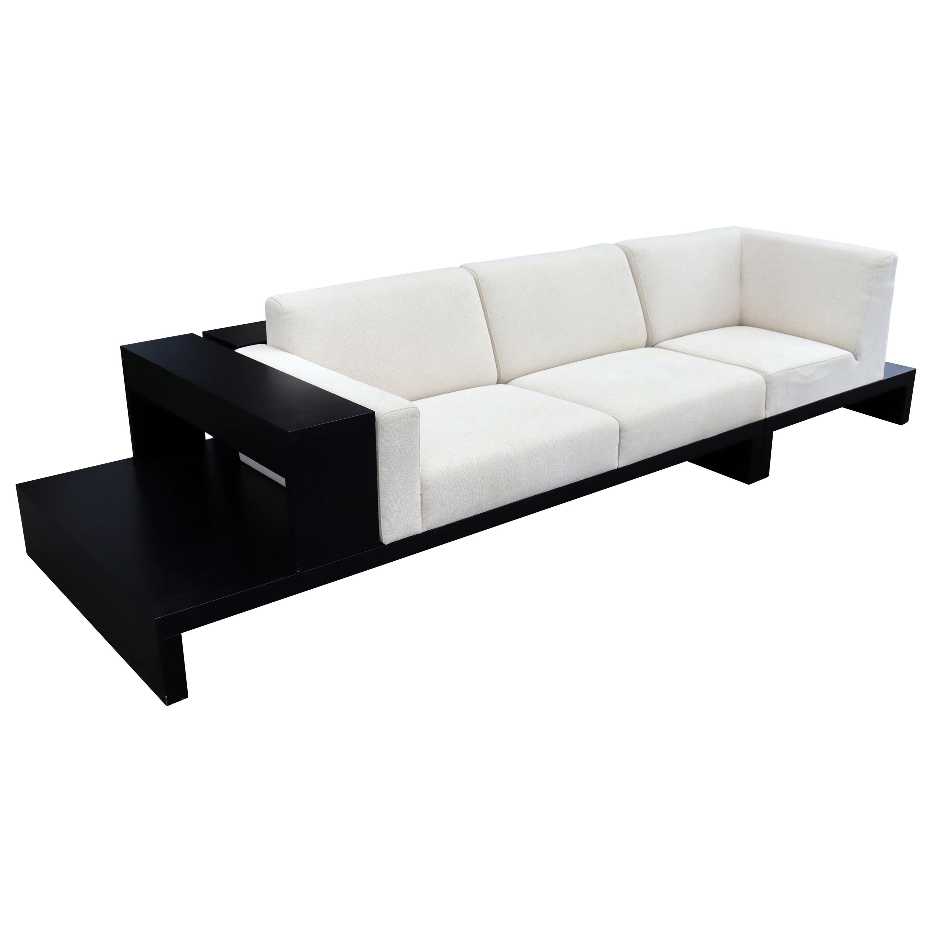 Contemporary Modernist Cream Sofa on Platform with Shelving