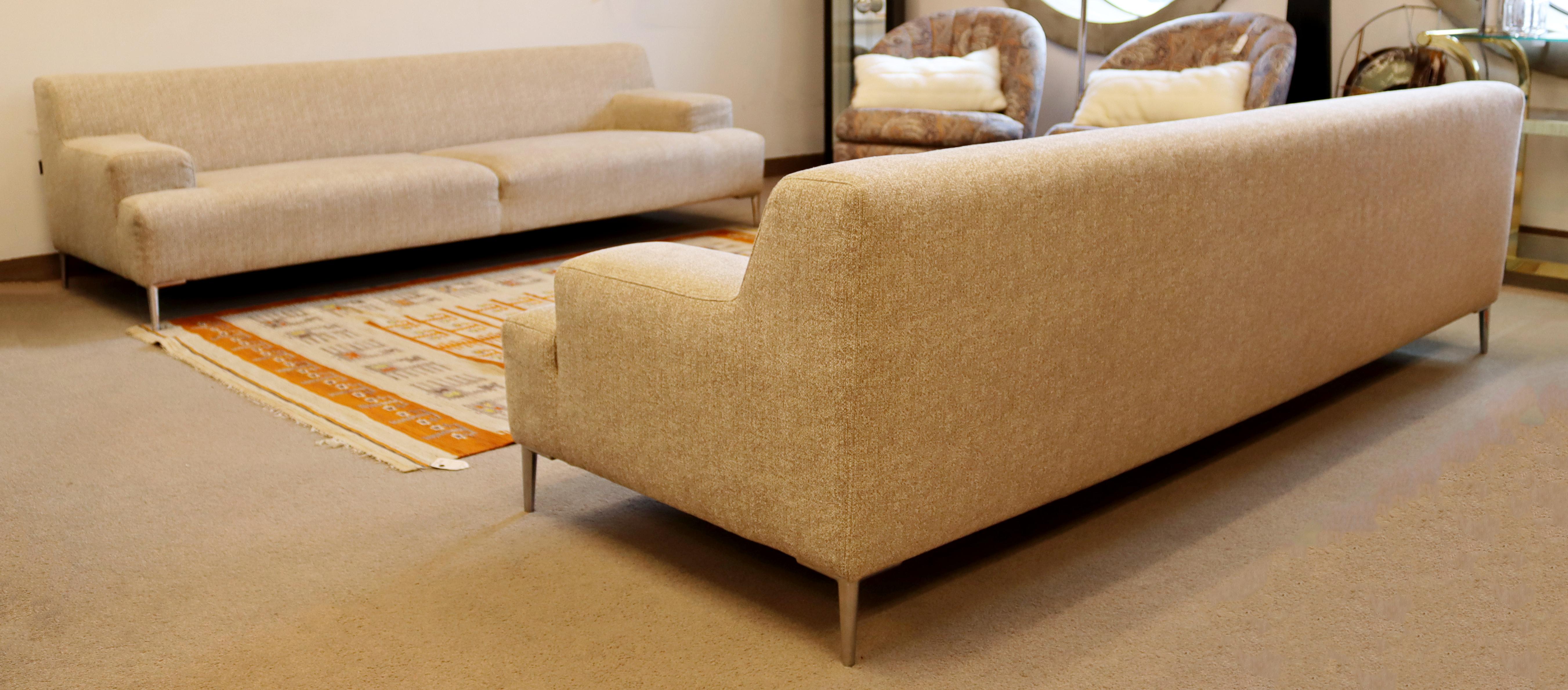 For your consideration is a magnificent pair of sofas, made in the USA, by Dellarobbia. In excellent condition. The dimensions of each are 90