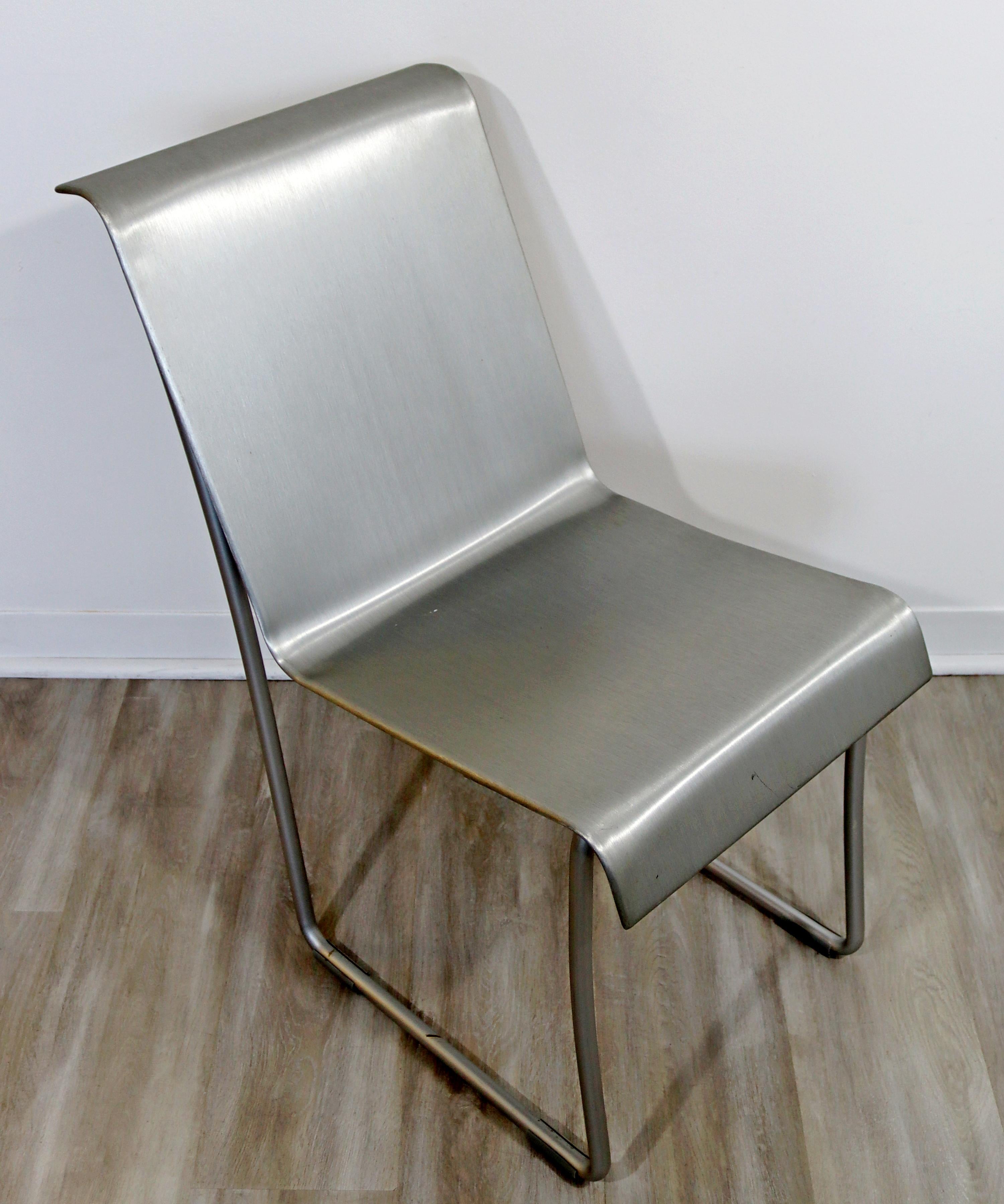 For your consideration is an ecclectic side or accent chair, made of brushed aluminum, by Frank Gehry for Emeco. In excellent condition. The dimensions are 16.5