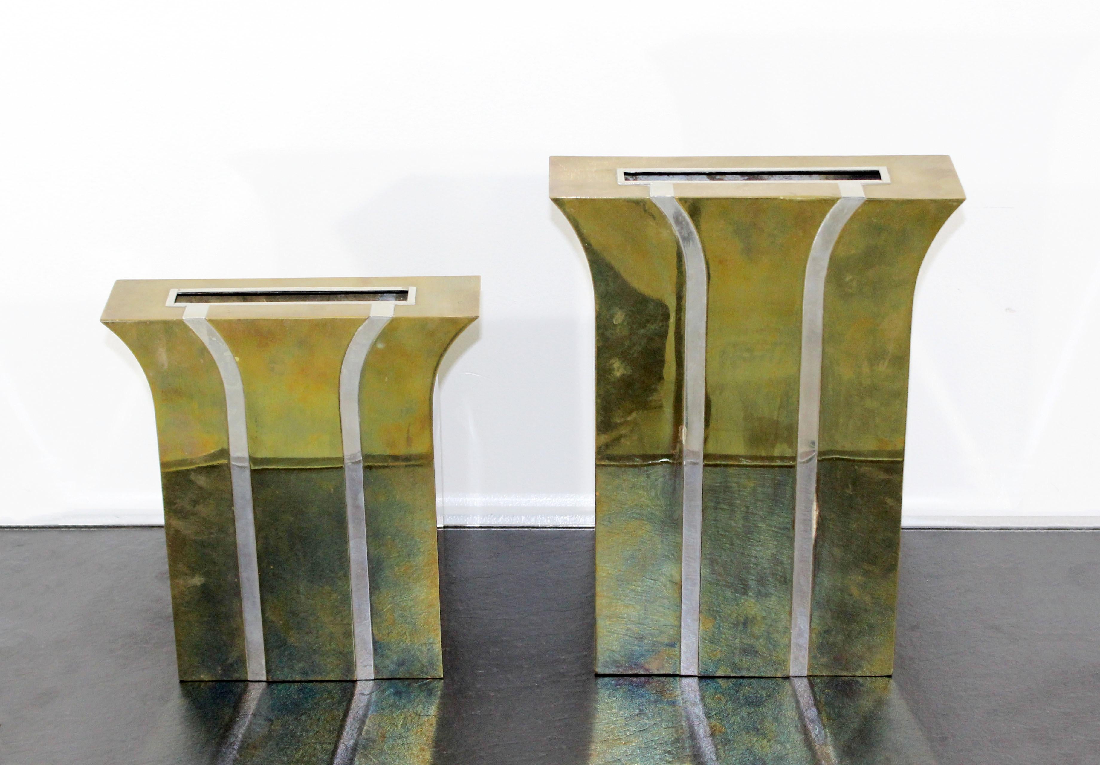 For your consideration is a fabulous pair of brass and chrome, decorative vases, made in Italy, by Dana International, circa 1983. In excellent condition. The dimensions of the taller are 9.5