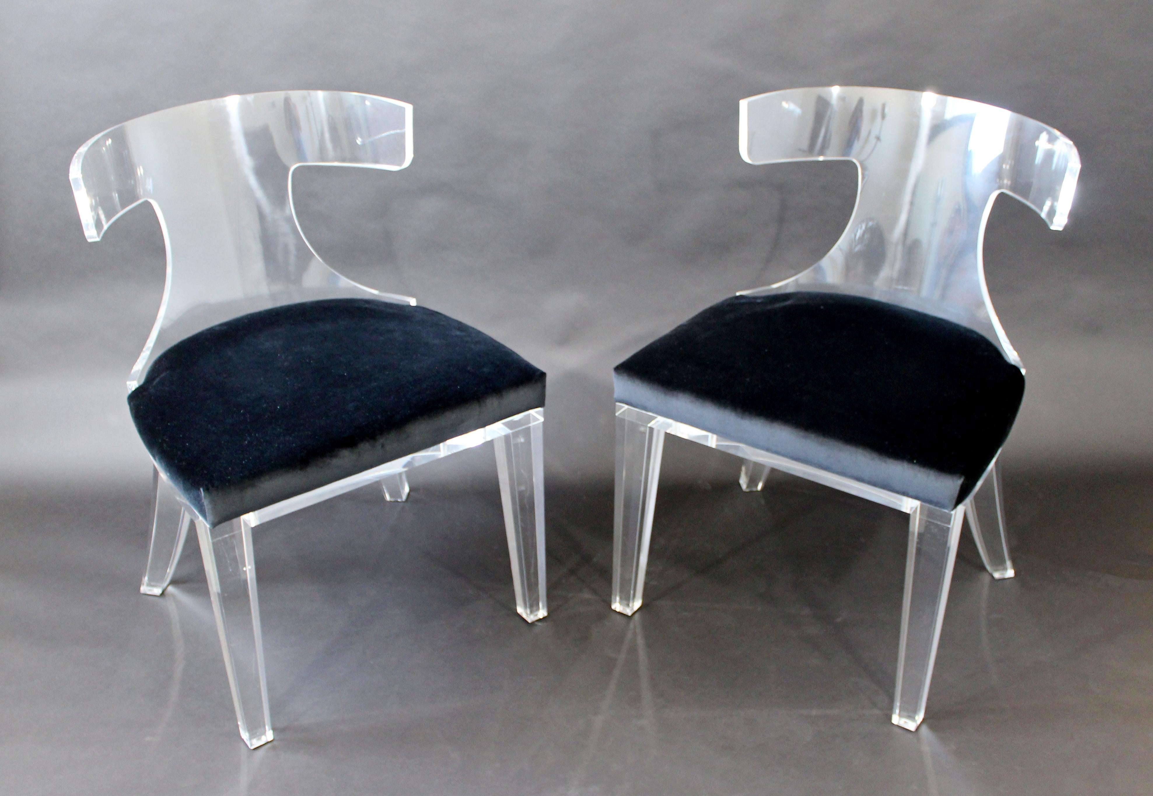 For your consideration is a stunning pair of curved Lucite side chairs, with velvet seats, by Safavieh Couture. In excellent condition. The dimensions are 22