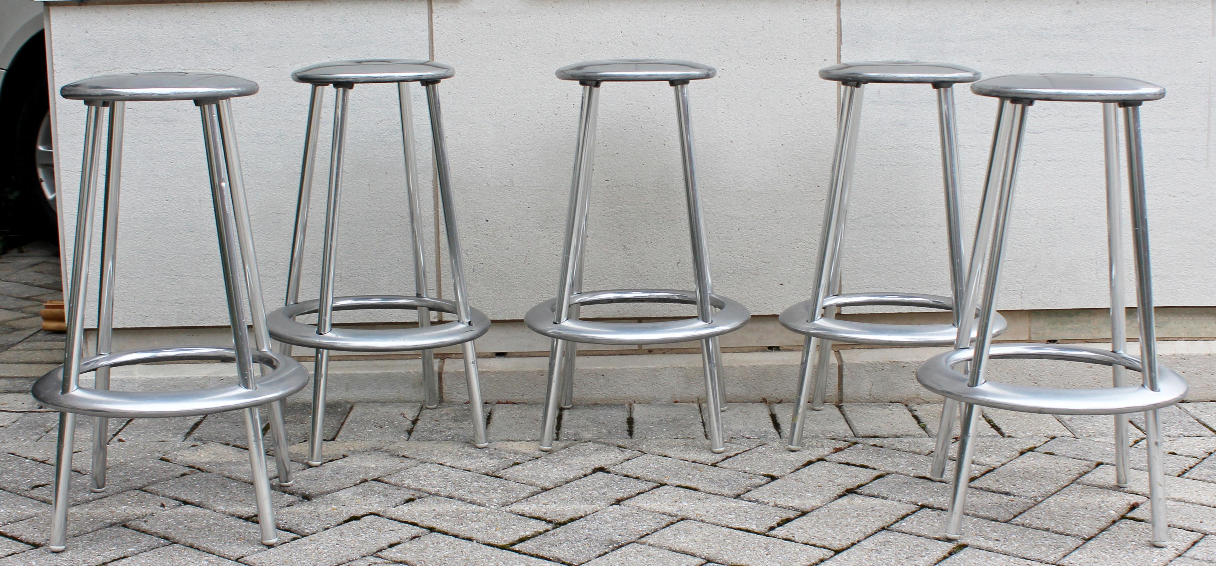 For your consideration is a fantastic set of five counter bar stools, made of polished aluminum the Luna collection by Marchant & Lyndon for Allermuir, circa 1990s. In excellent condition. The dimensions are 29