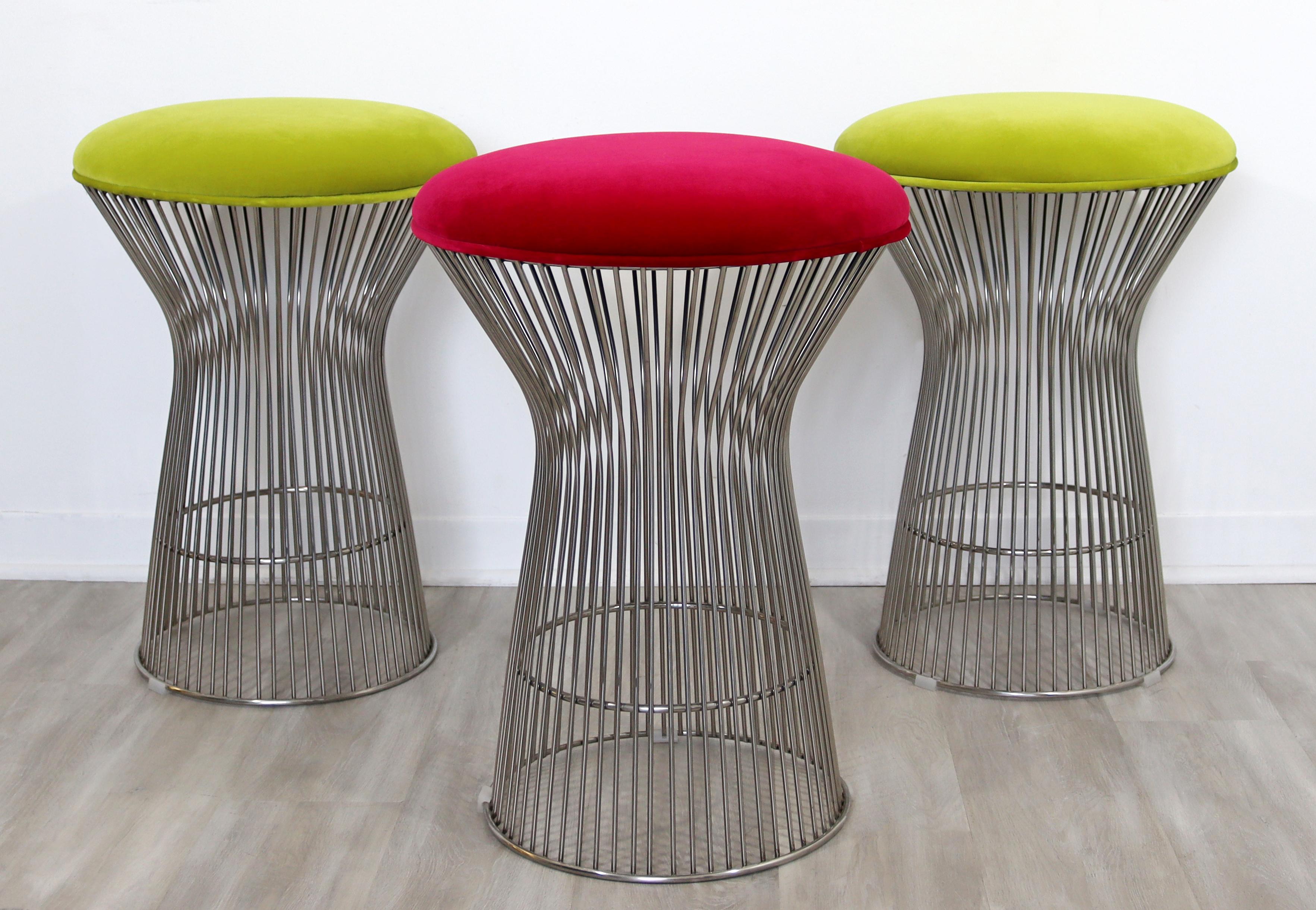 For your consideration is a thrilling set of three counter bar stools, made of chrome and with velvet seats, in the style of Warren Platner. In excellent condition, with a couple small, hard to notice spots on the seats. The dimensions are 18