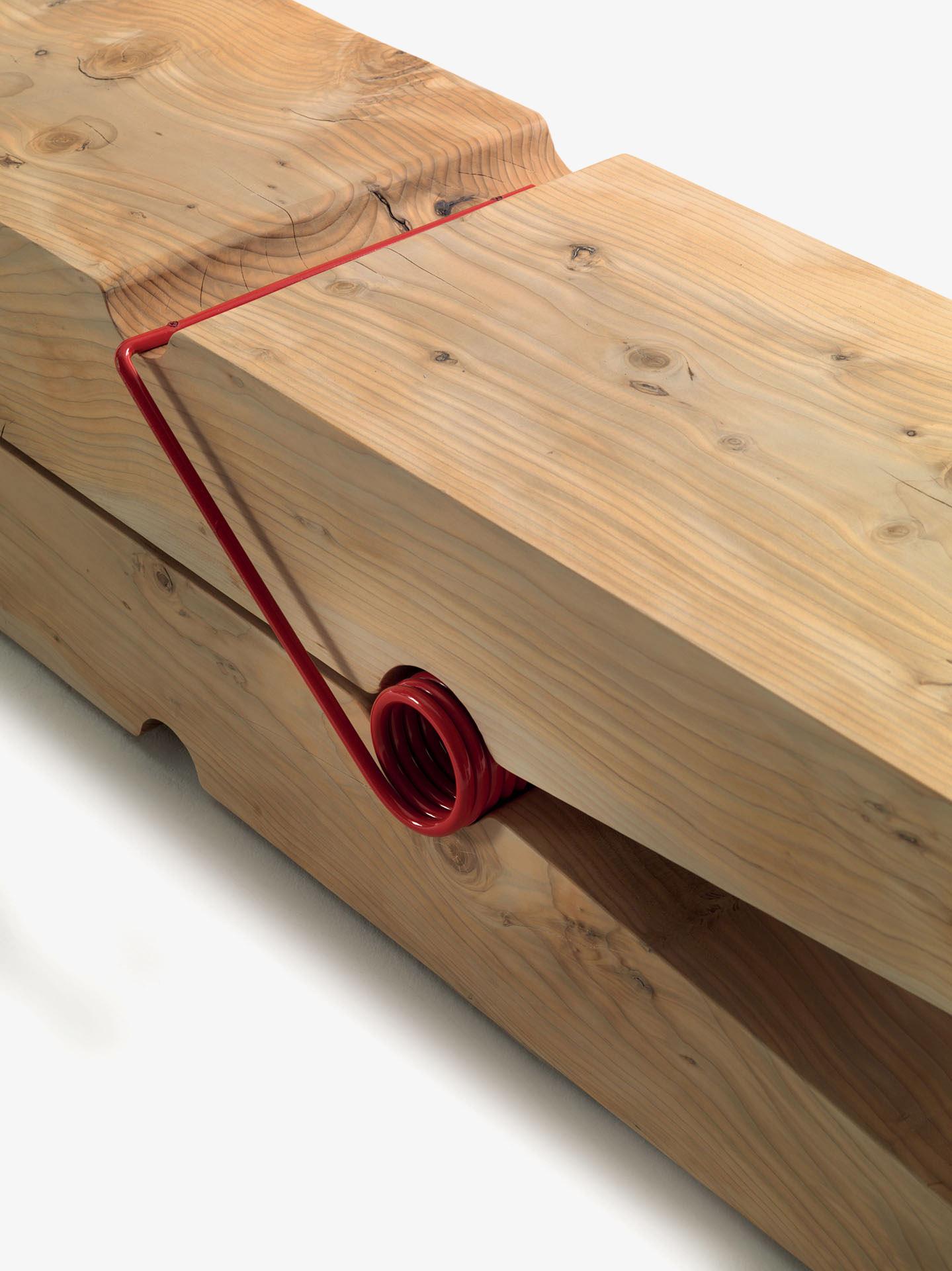 Bench made of solid scented cedar worked from single blocks. It features a sculptured design that experiments with the Classic Pop Art off-scale approach.