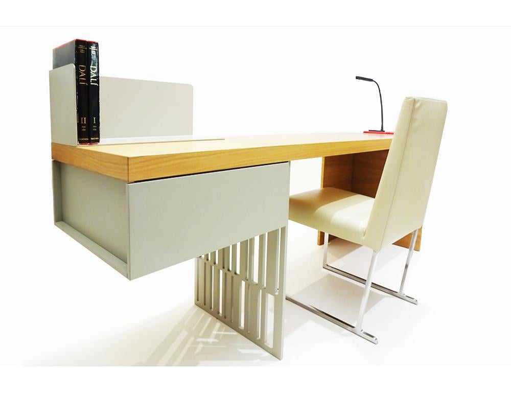 A beautiful contemporary oak and metal desk designed by Patricia Urquiola matched to 2 B&B Italia Solo ivory leather and satin chrome chairs designed by Antonio Citterio. 

If you’re working from home or need a clean simple lined desk for an