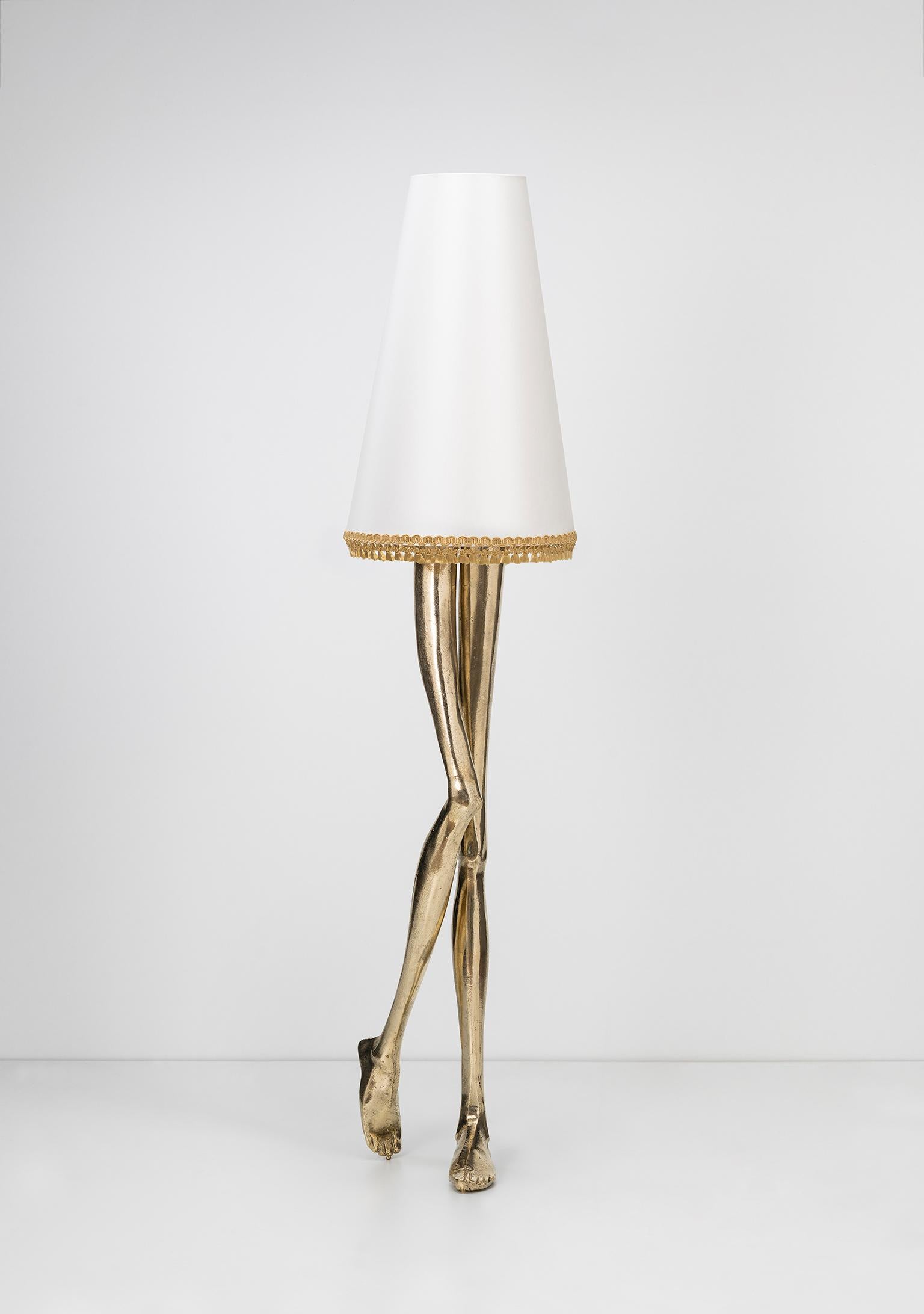 Inspiration: 
Marilyn Monroe, the sexiest Pin-up of the 1950s, inspired a piece of Art & Design. The design of the Monroe Lamp captures the essence of her image and the sensuality of her legs. The lampshade and the gold tassel fringe complement the