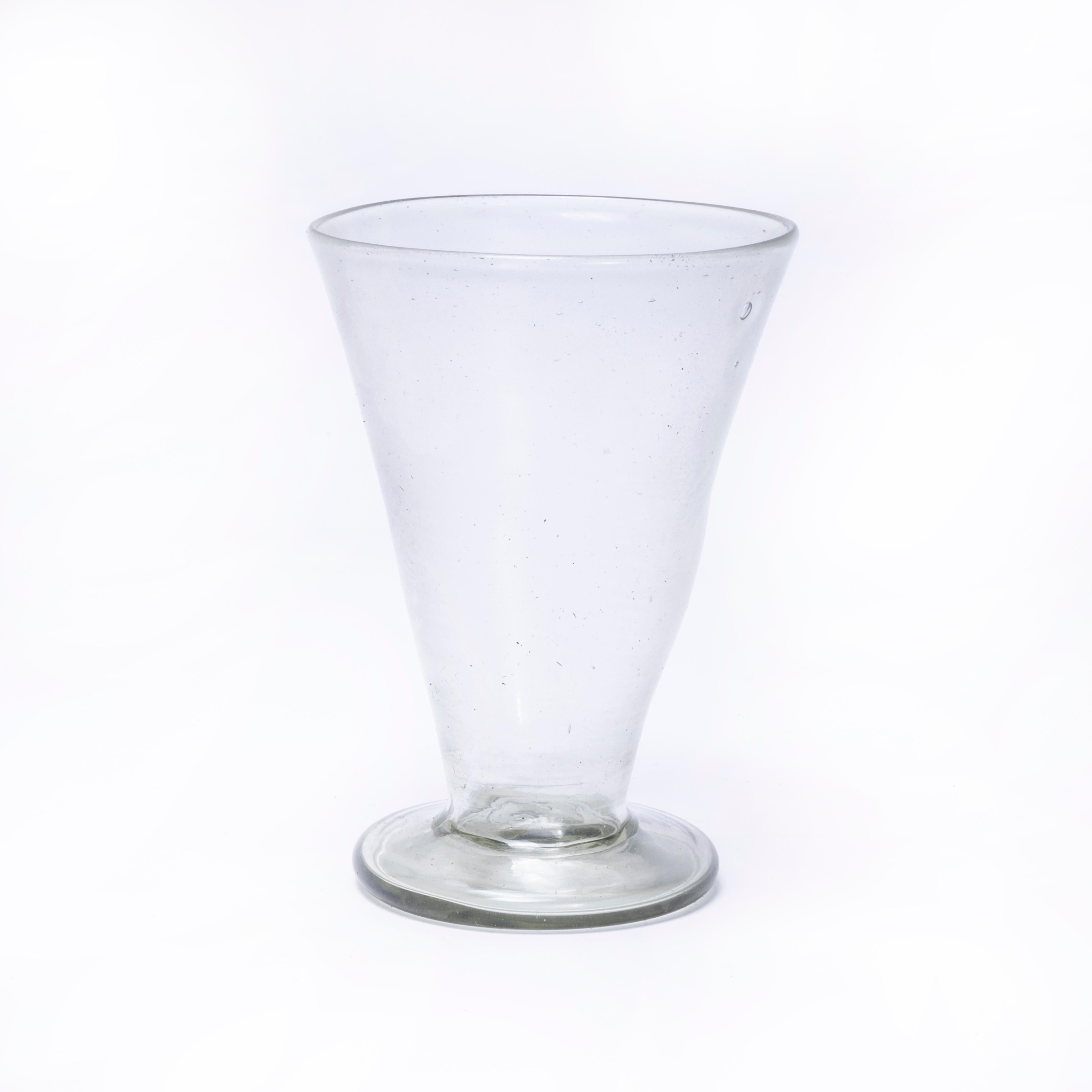 Contemporary Moroccan Conical Glasses - Set Of Six. Hand-made in Morocco. The glass is mouth blown and available in a set of assorted colours as shown. The glass is mouth blown in a wonderful artisan quality. Because of the artisan production the