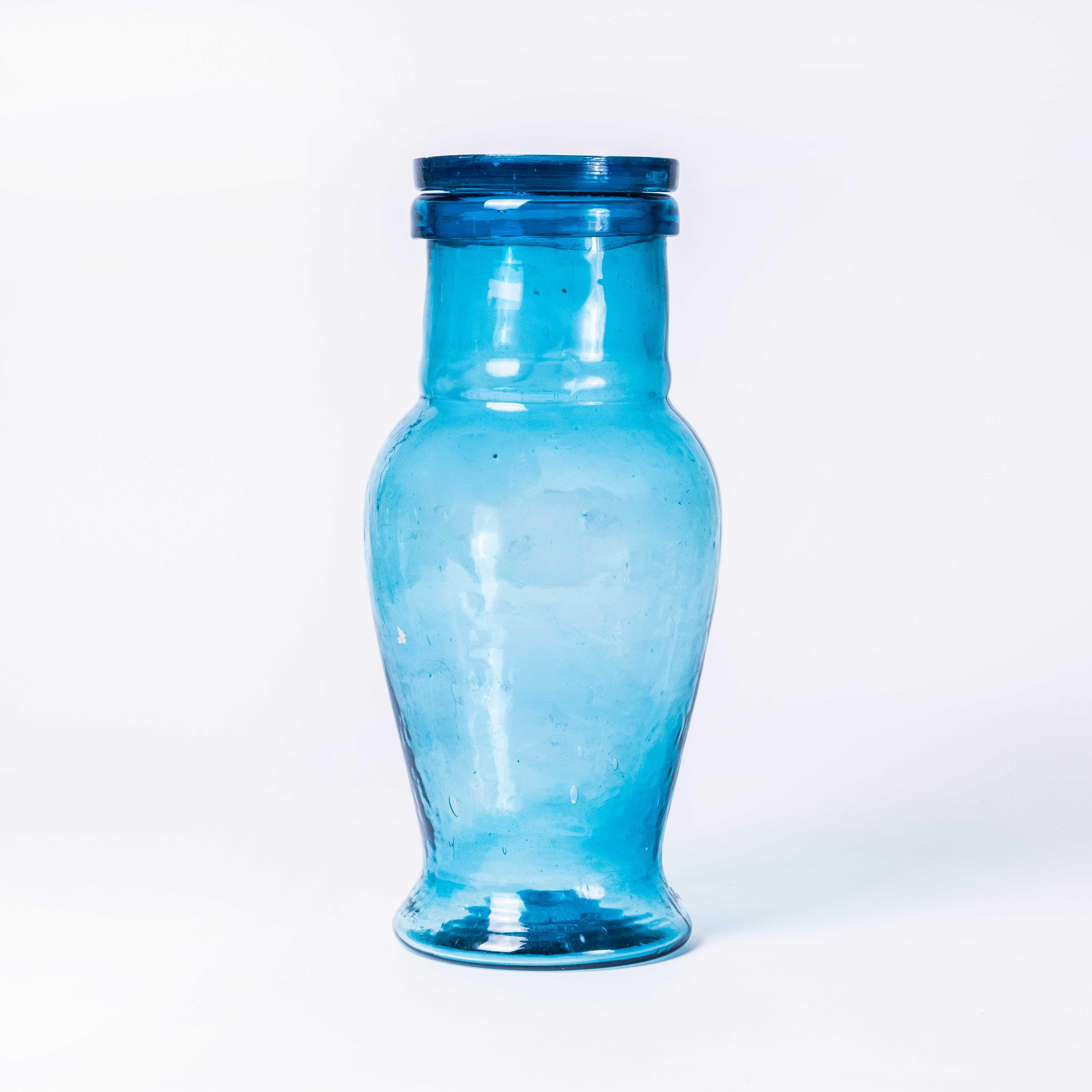 Contemporary Moroccan Mouth Blown Glass Jar - Light Blue. 

Hand-made in Morocco. The glass is mouth blown and available in an assortment of colours. Each jar comes with a heavy lid. Superb artisan quality. Listing is for one Jar.

Workshop