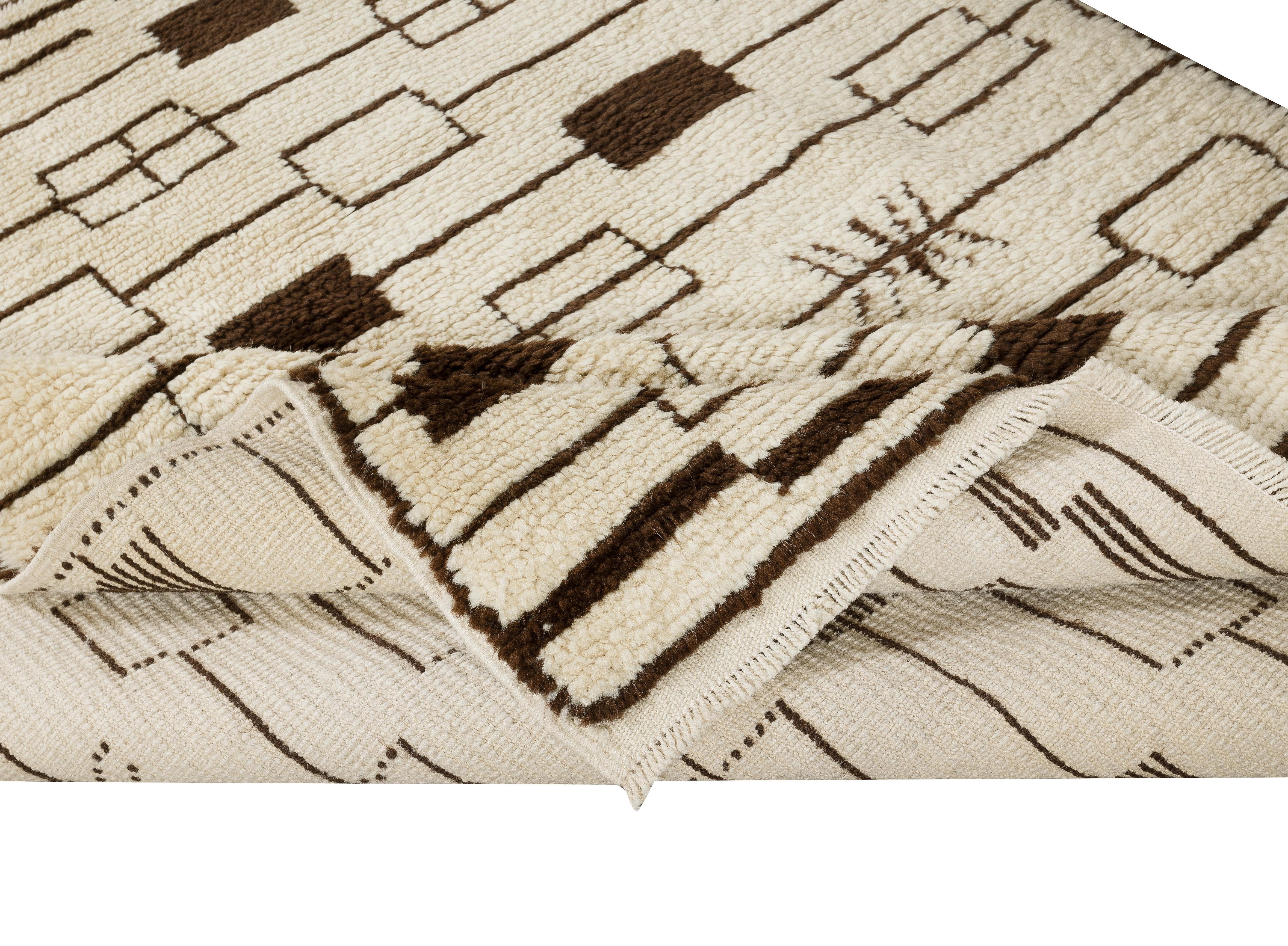 A new handmade rug made of natural un-dyed sheep wool.
The design is inspired from midcentury Moroccan rugs.
The rug is available as seen or if requested, it can be custom produced in a different size, color combination and design. 
Measures: 5 x